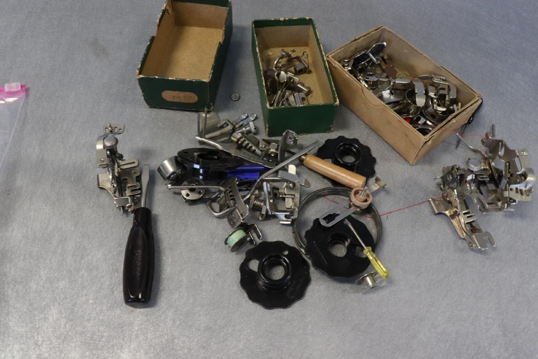 Large Lot Vintage Sewing Machine Attachments: Includes different presser feet, bobbins, tools.