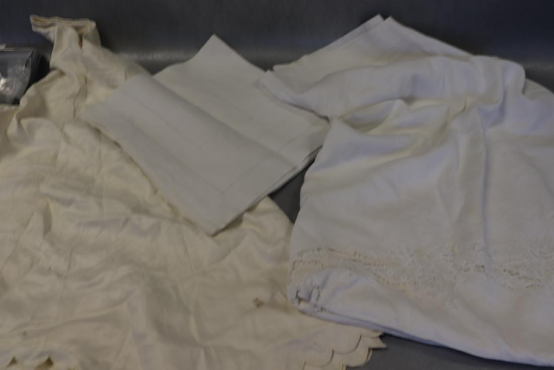Lot of 3 Vintage Linen Tablecloths: White Linen with "DHD" monogram, drawn-thread work edging, 53x55", good condition. White linen cotton blend with lace insertions, 65x82", some breaks in the lace. Round cream color damask linen cloth,