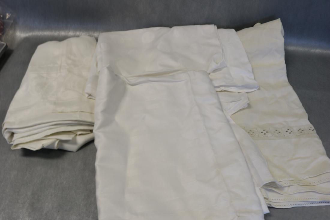 Lot of 3 Vintage Damask Linen Tablecloths: Includes: 132x70", a few light spots. 64x104", a few small holes, light marks. 66x102, storage soil. Linen cloth with cut-work, 72x66, nice condition.
