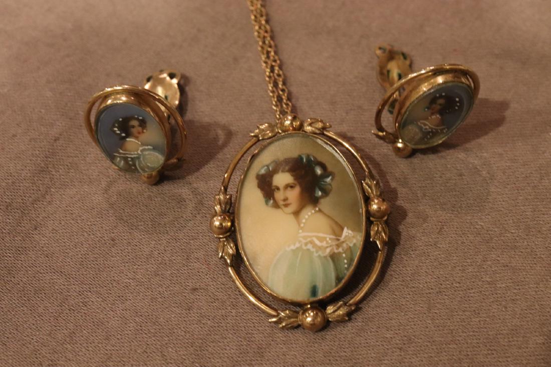 Vintage Gold-Filled Necklace and Clip-On Earring Set: 12k gold filled. The portrait pendant can be worn as a brooch or pendant, it measures approx. 1 3/8" long. The clip-on earrings are approx. 3/4" long. All in good condition.