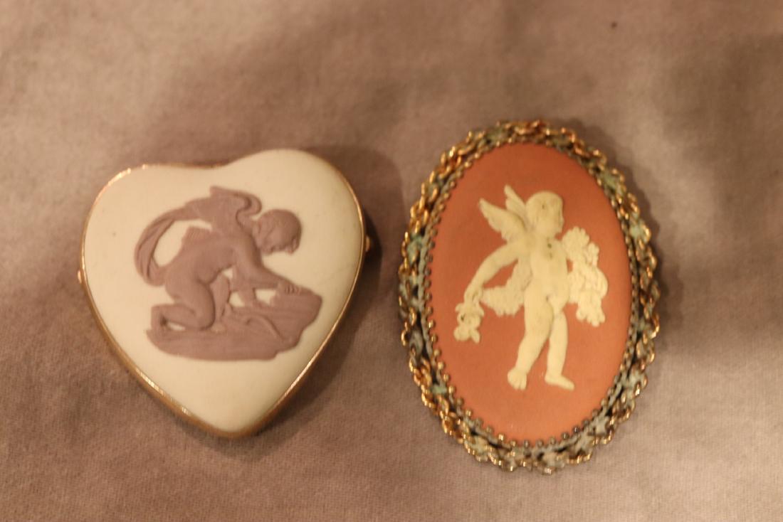 Lot of 2 Vintage Brooch Pins, Wedgwood: Both made in England, oval is approx. 1 7/8" long, loop for hanging as well as clasp. Heart pendant also has a loop and clasp. Both in good condition.