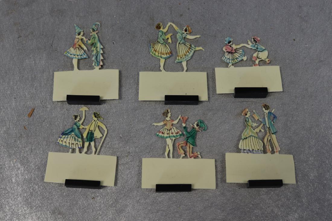 Set of 6 Hand Cut & Painted Celluloid Place card: circa 1920, with black stands