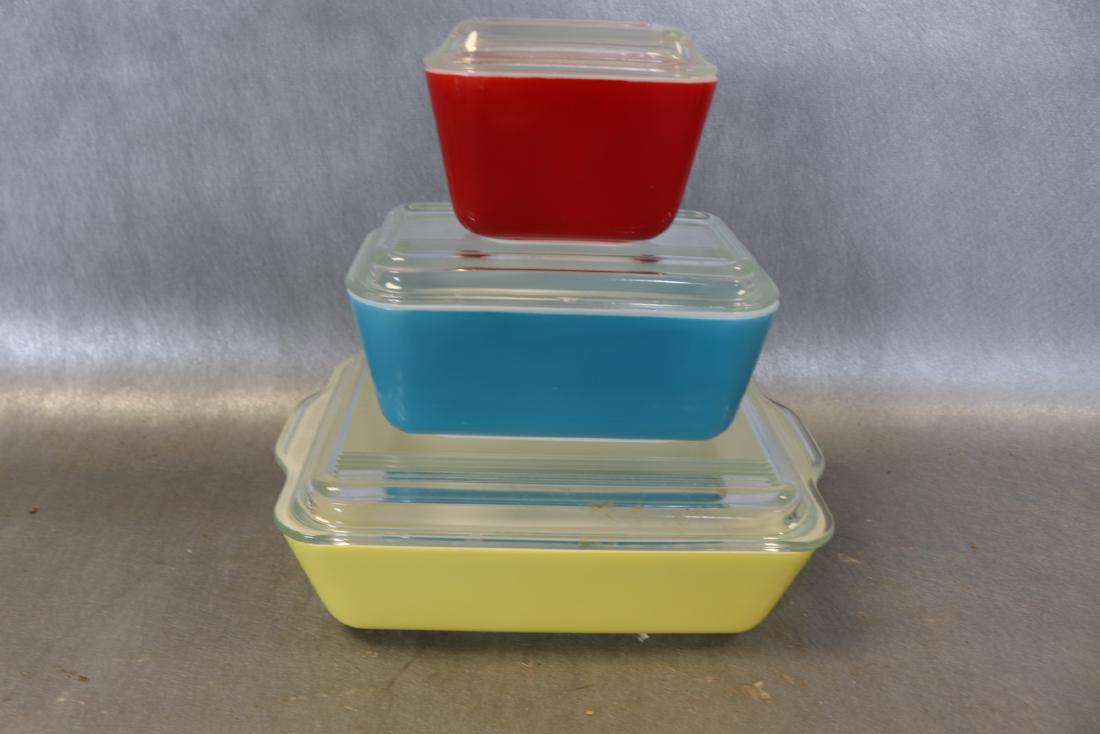 3 Piece Set, Pyrex Covered Oven Ware: number 18 yellow, 5 blue and 38 red all with covers, small chip on blue lid