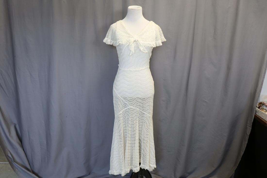 1930's Sheer Lace Fitted Summer Dress: Incredible 1930's lace dress with crossover design in back, bow in front, net ruffles, side snaps (one missing), shawl collar detail, approx. 32 bust, 26 waist. Missing 2 side snaps, very light discol