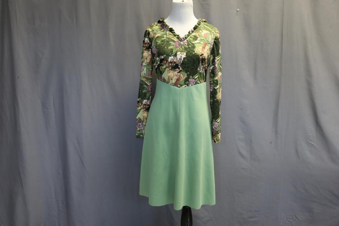 1970's Knit Dress w Printed Jersey Bodice: Green knit dress with printed bodice in the style of Peter Max, ruffled neckline, zipper back, Hem is cut (not finished), approx. 36 bust, 30 waist, 37 long.