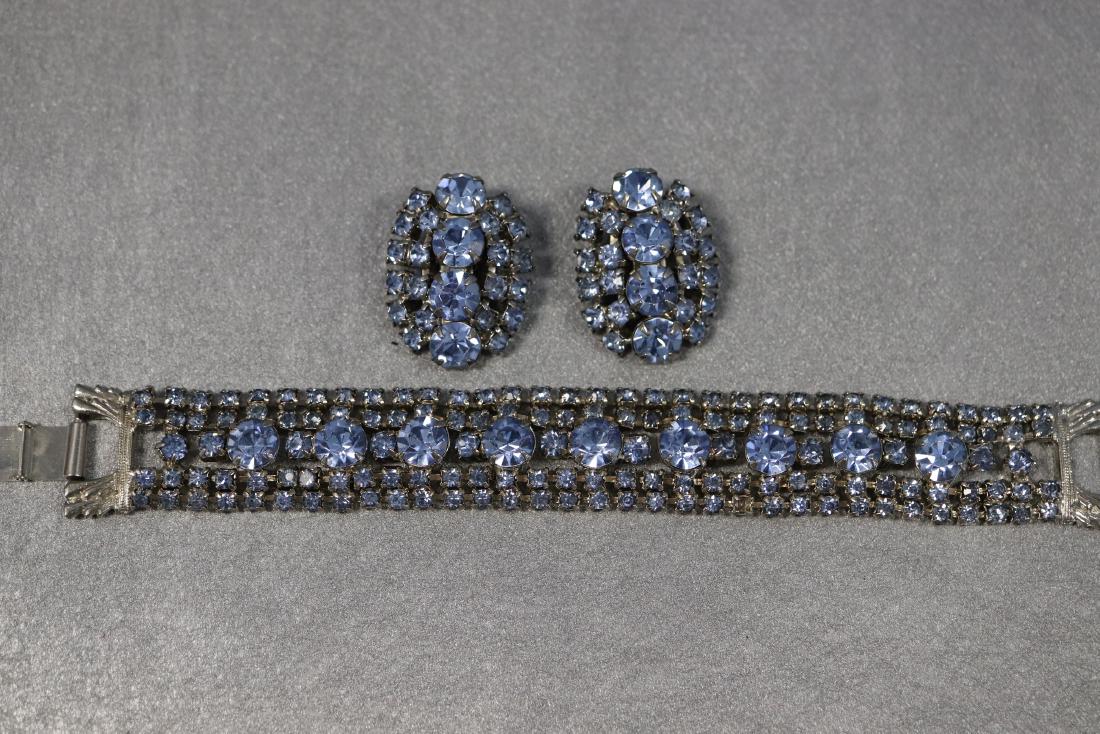 Vintage Blue Sapphire Crystal Rhinestone Bracelet &: five row tennis bracelet style with center row of bigger stones, approx. 7 inches long and matching clip on earrings, one tiny stone missing from bracelet