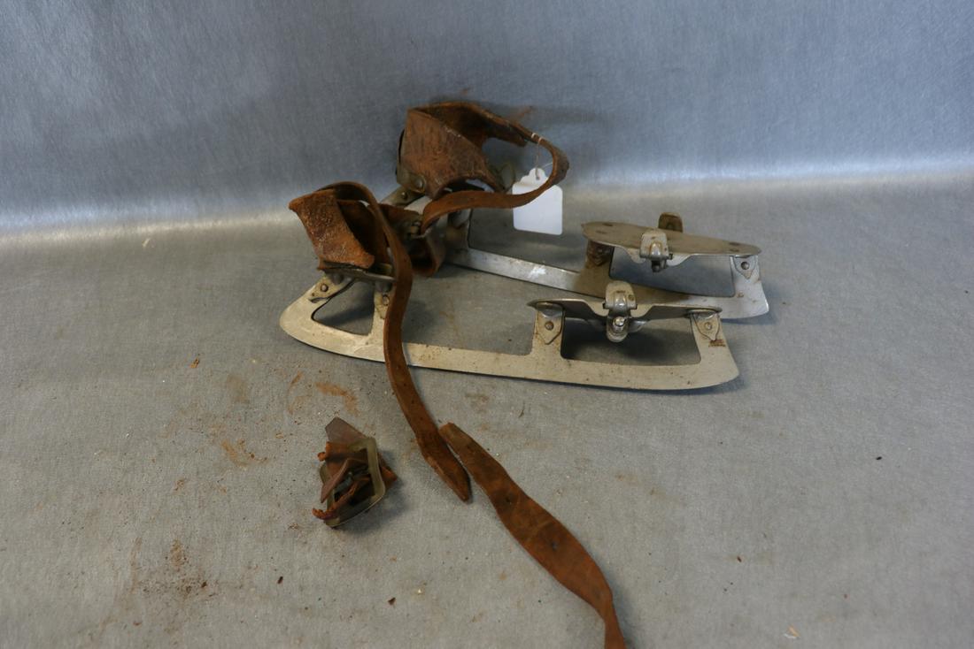 Antique "A G Spalding Bros" Clamp-On Ice Skates: Karbonite Steel Hardened With leather straps, marked Canadian Club. Blades are 11.5" long. Some damage and age to the leather.