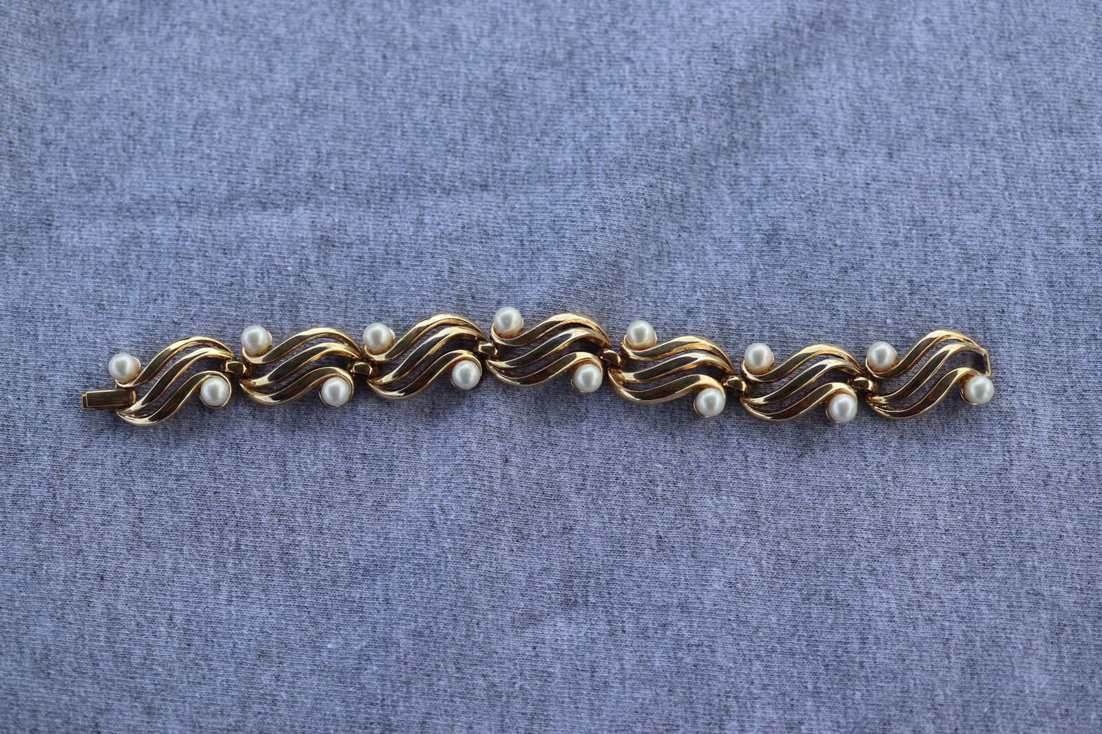 Trifari Gold tone & Faux Pearl Bracelet: Approx. 7" long.