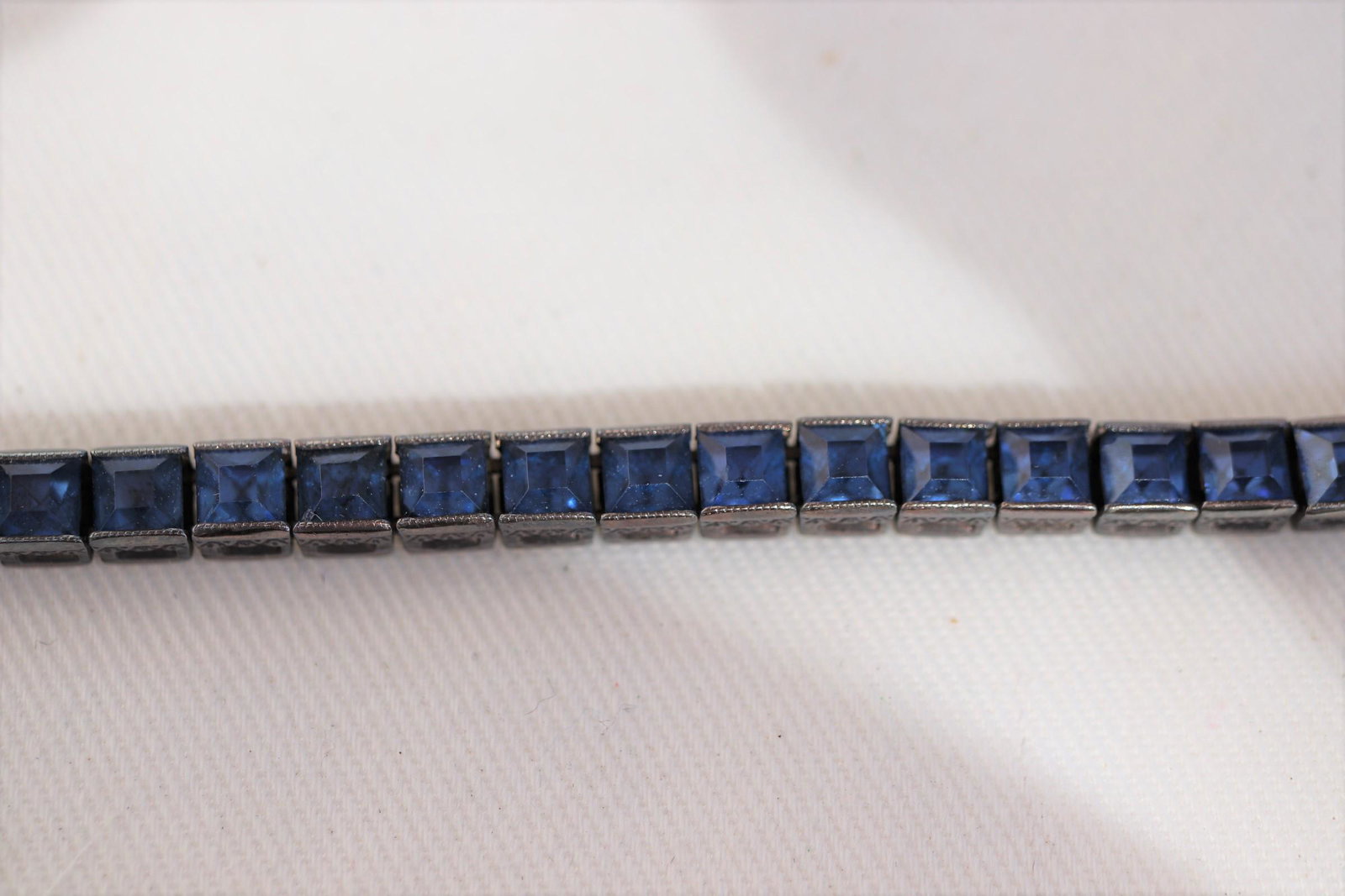 Vintage Otis Sterling Blue Stone Tennis Bracelet: Approx. 7" long, marked sterling.