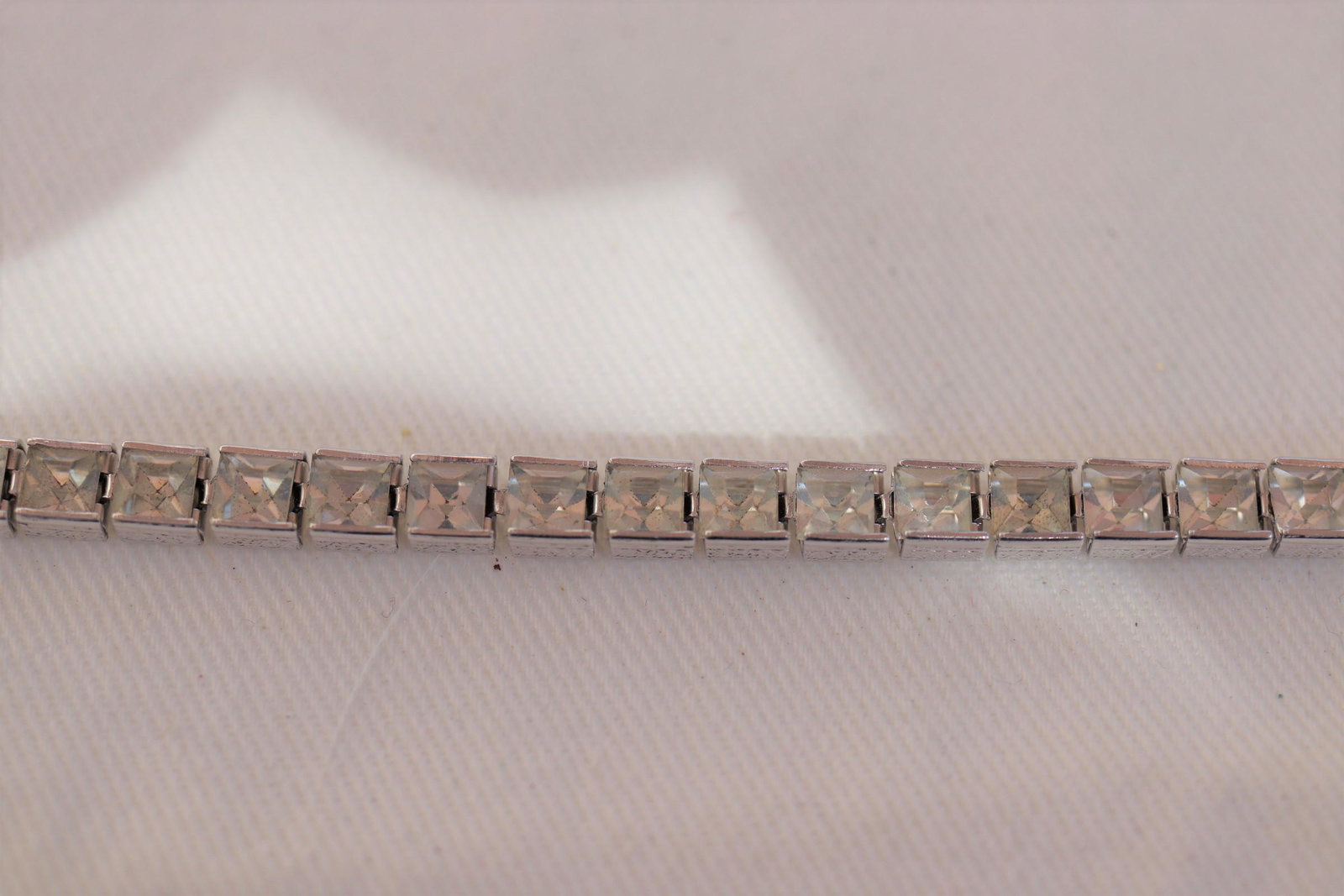 Silver tone Tennis Bracelet with Rhinestones: Approx. 7" long, marked sterling.
