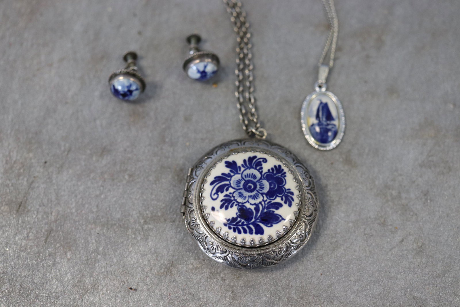 Lot of Vintage Delfts Necklace Pendant, Earrings Plus: Earrings are screw-back, necklace pendant is approx. 3/4" long. Locket approx. 1 1/2" wide. All marked Delfts except the locket.