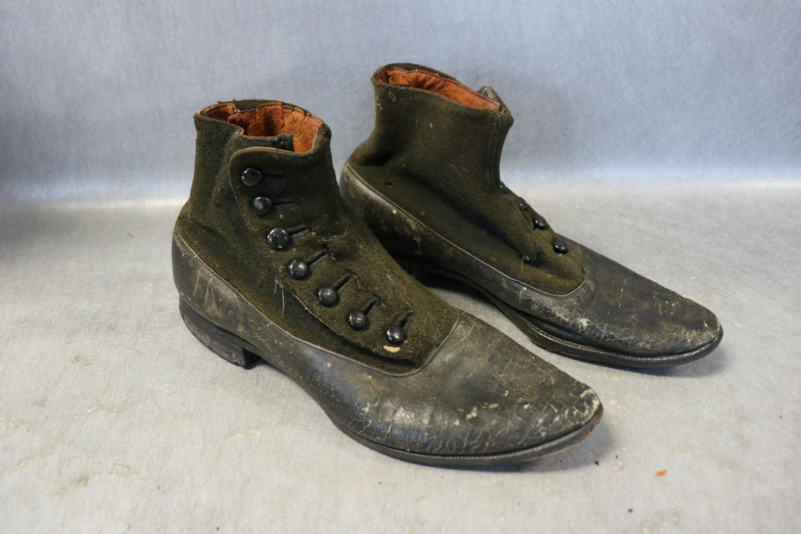 Antique High Button Shoes, Boots: Marked Cinderella, leather shoe with wool upper section, canvas lined, approx. 10" long, 3" wide. Cracks in leather, wear on wool.