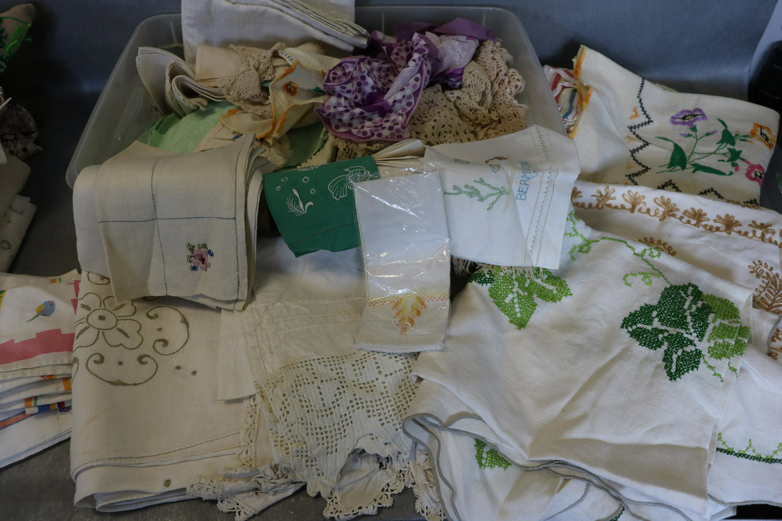Large Lot of Vintage Linens: including table cloths, doilies, runners, towels, and more, embroidered, cross stitch, crochet, printed and more