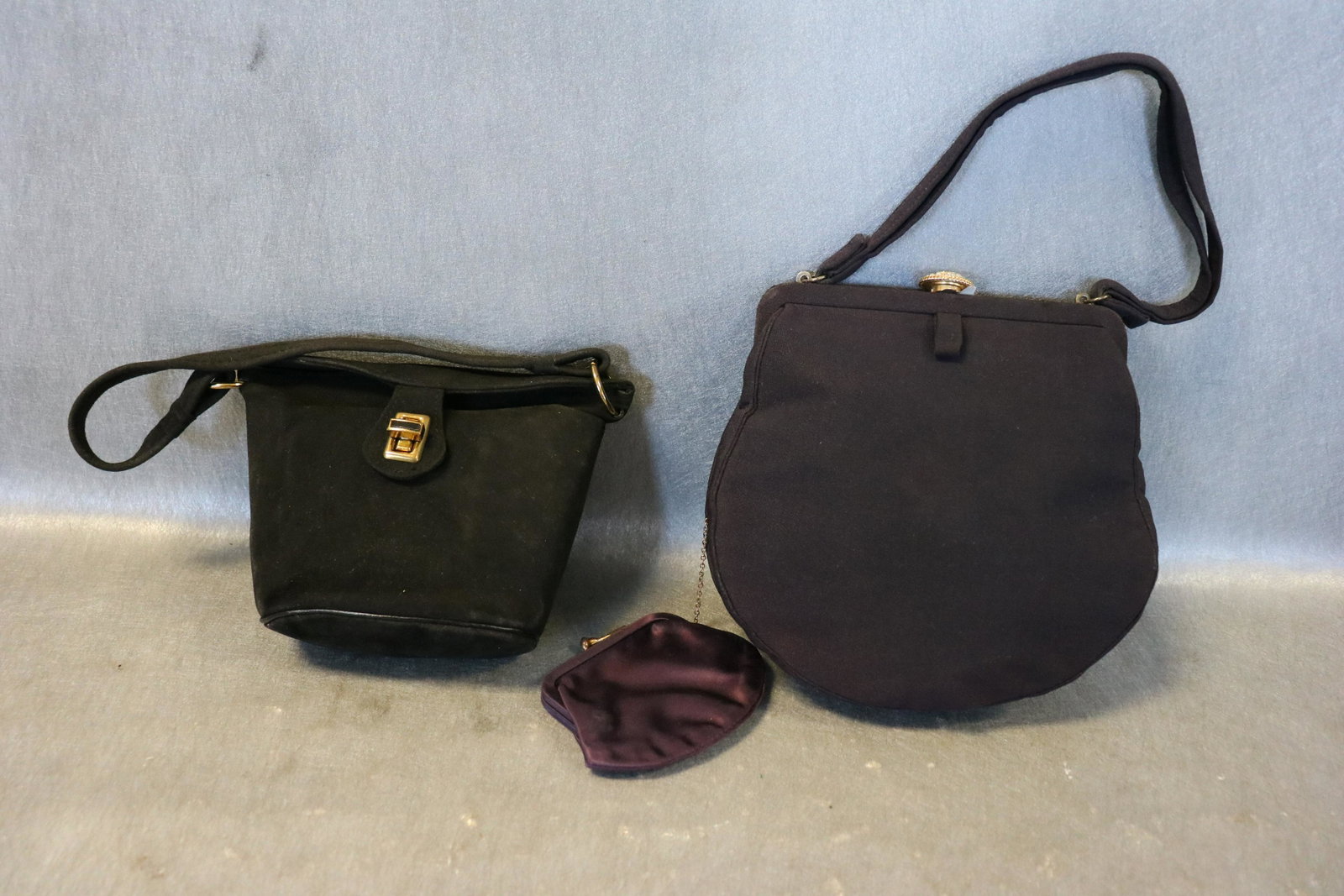 Lot of 2 Vintage Purses, Sax Fifth Avenue, Other: Dark navy Sax Fifth Avenue with inside pocket and attached coin purse, 7x7", very light wear. Black suede-like purse, 5x6", inside pocket with mirror. The black finish rubs off easily.