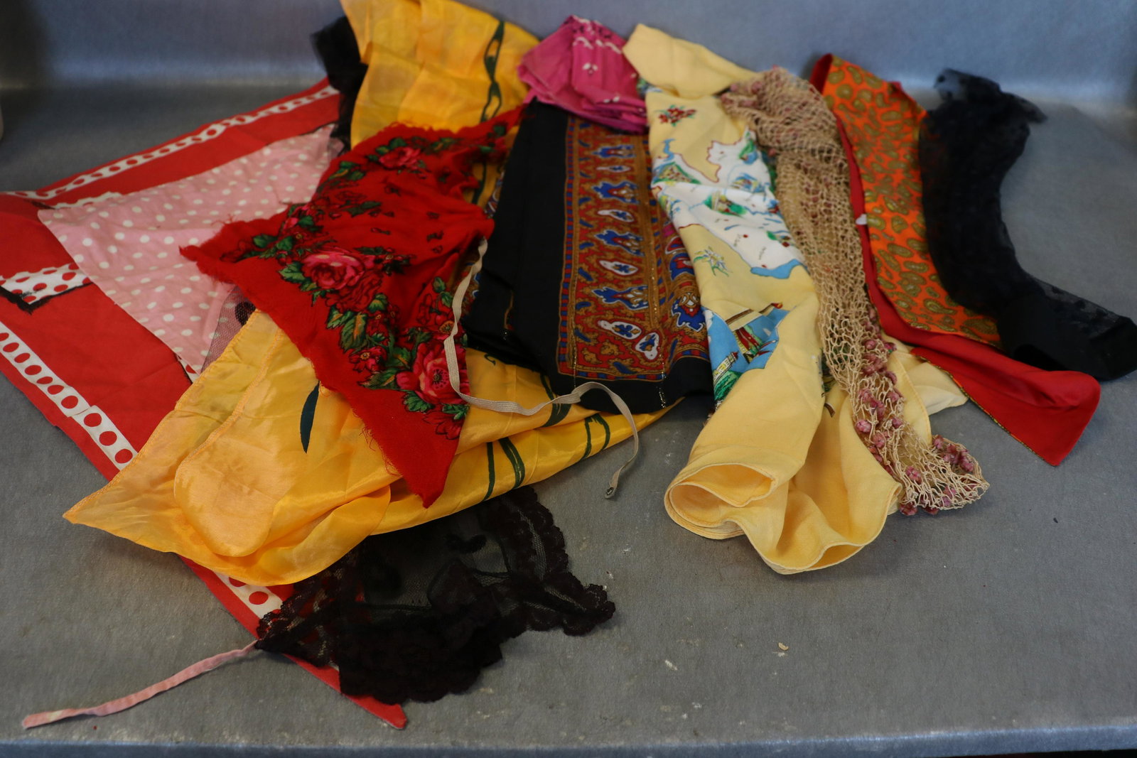 Lot Antique and Vintage Scarves, Kerchiefs: Includes lace mantilla, hand knotted head covering with pink velvet dots, Switzerland scarf, pink bandana, others.