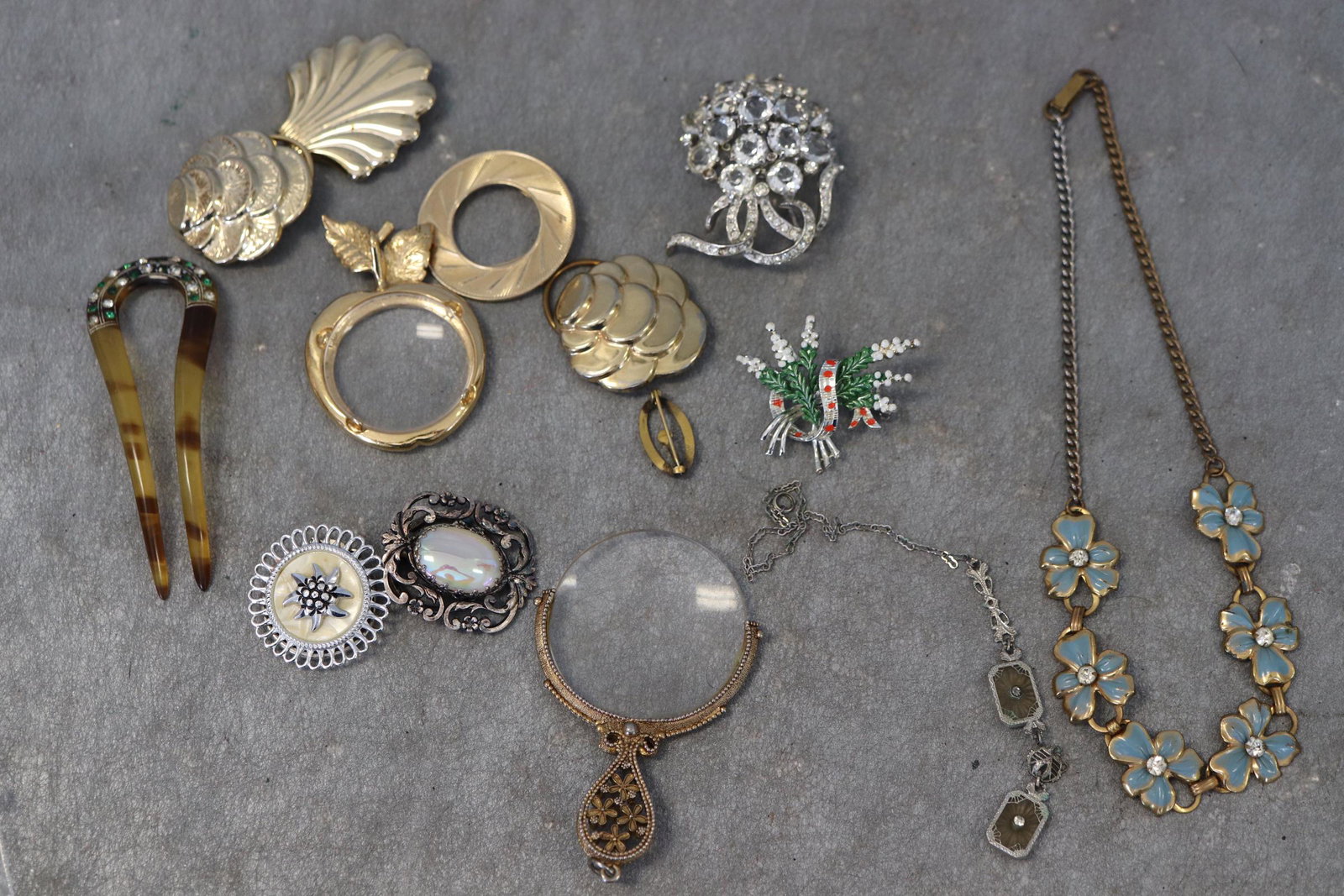 Lot Of Vintage Scarf Clips, Brooch Pins, Pendants: Includes rhinestone brooch, Bakelite hair comb, enameled bracelet, others.