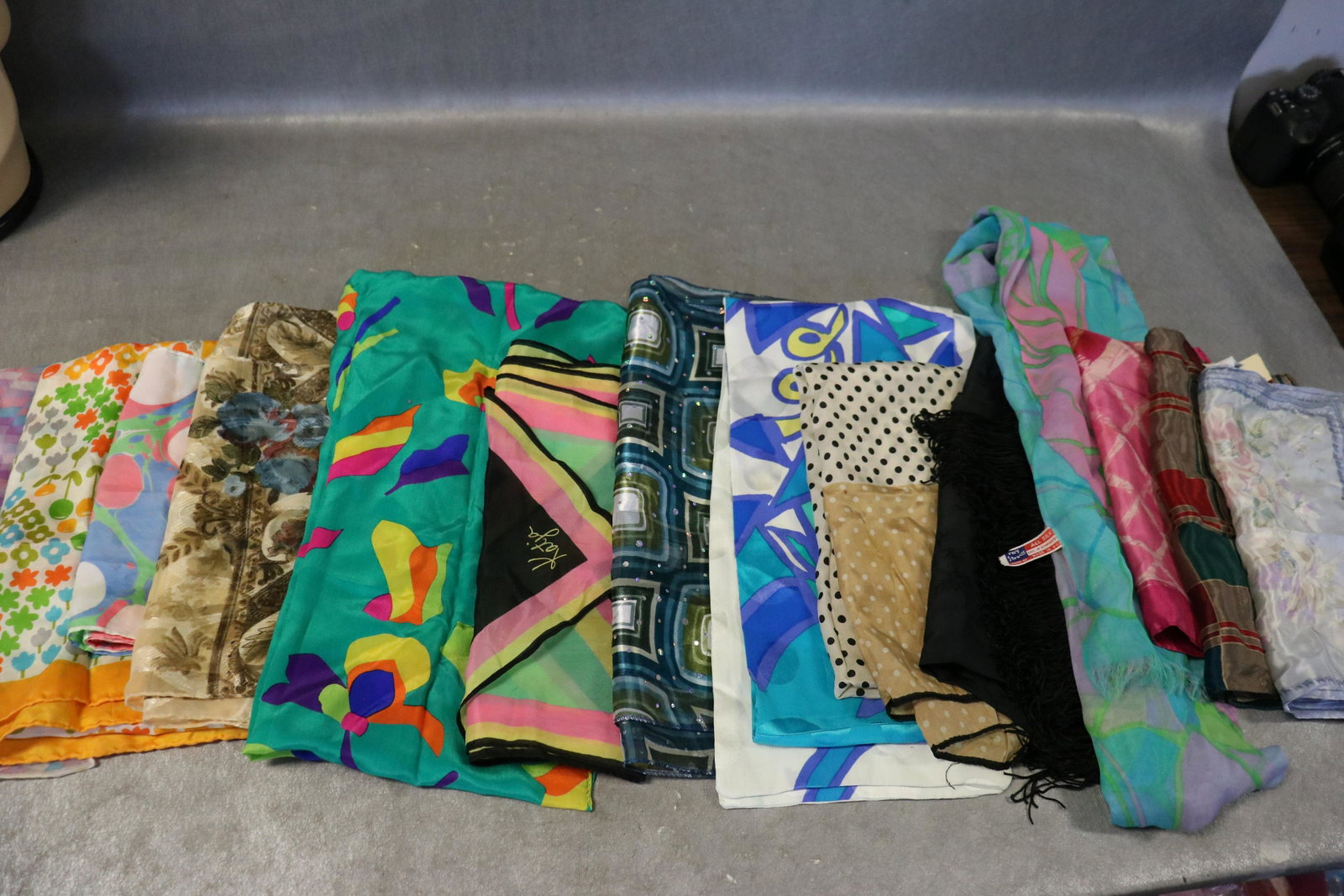 Lot Of 14 Vintage Silk Scarves: Includes Ray Strauss, Glentx, Liz Claiborne, Katja. Many with hand rolled edges. Small holes in purple scarf, light soil on a few.