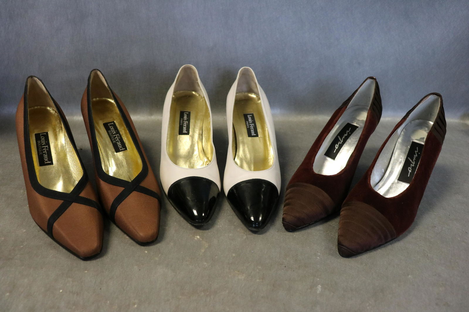 Lot Of 3 Ladies Pumps, Shoes: Louis Feraud brown pumps, 9 1/2, 3" heel, very good condition-no wear. Louis Feraud white leather with black patent leather toe, size 10, 2 1/2" heel, light wear, appears to have lost the end cap on t