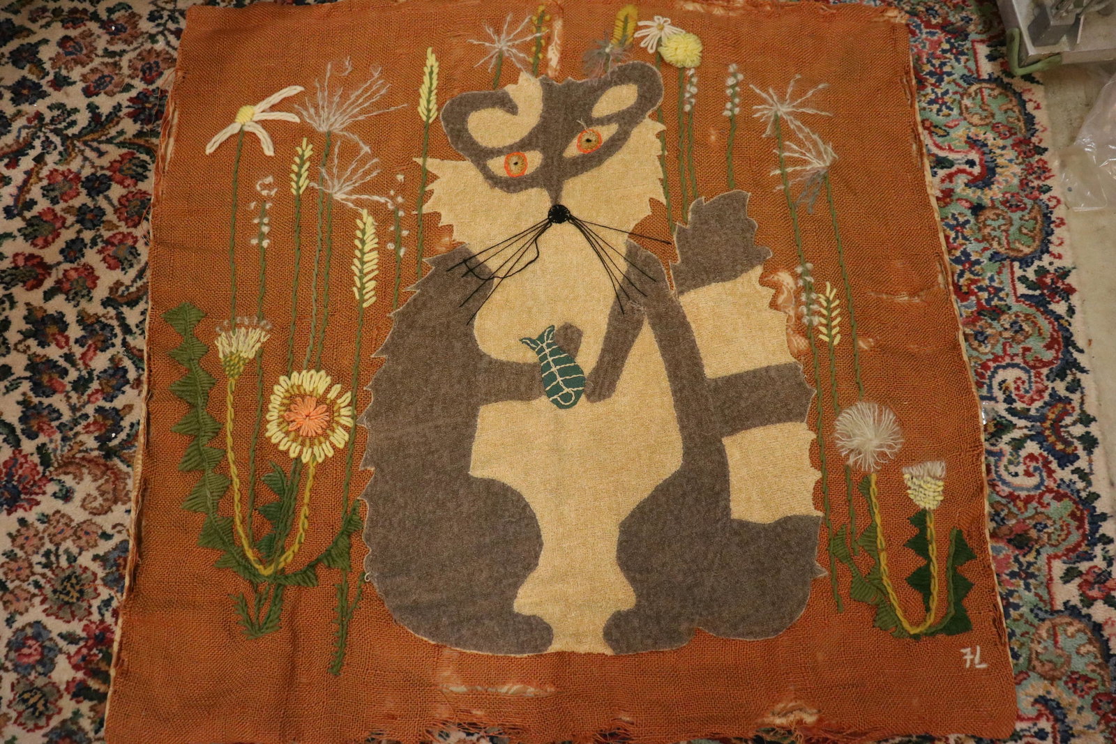Vintage Burlap & Embroidered Raccoon Wall Hanging: Embroidered with angora and wool yarns, terry cloth applique make up the raccoon, all on burlap. Damask backing. Some rips in the burlap, see photos.