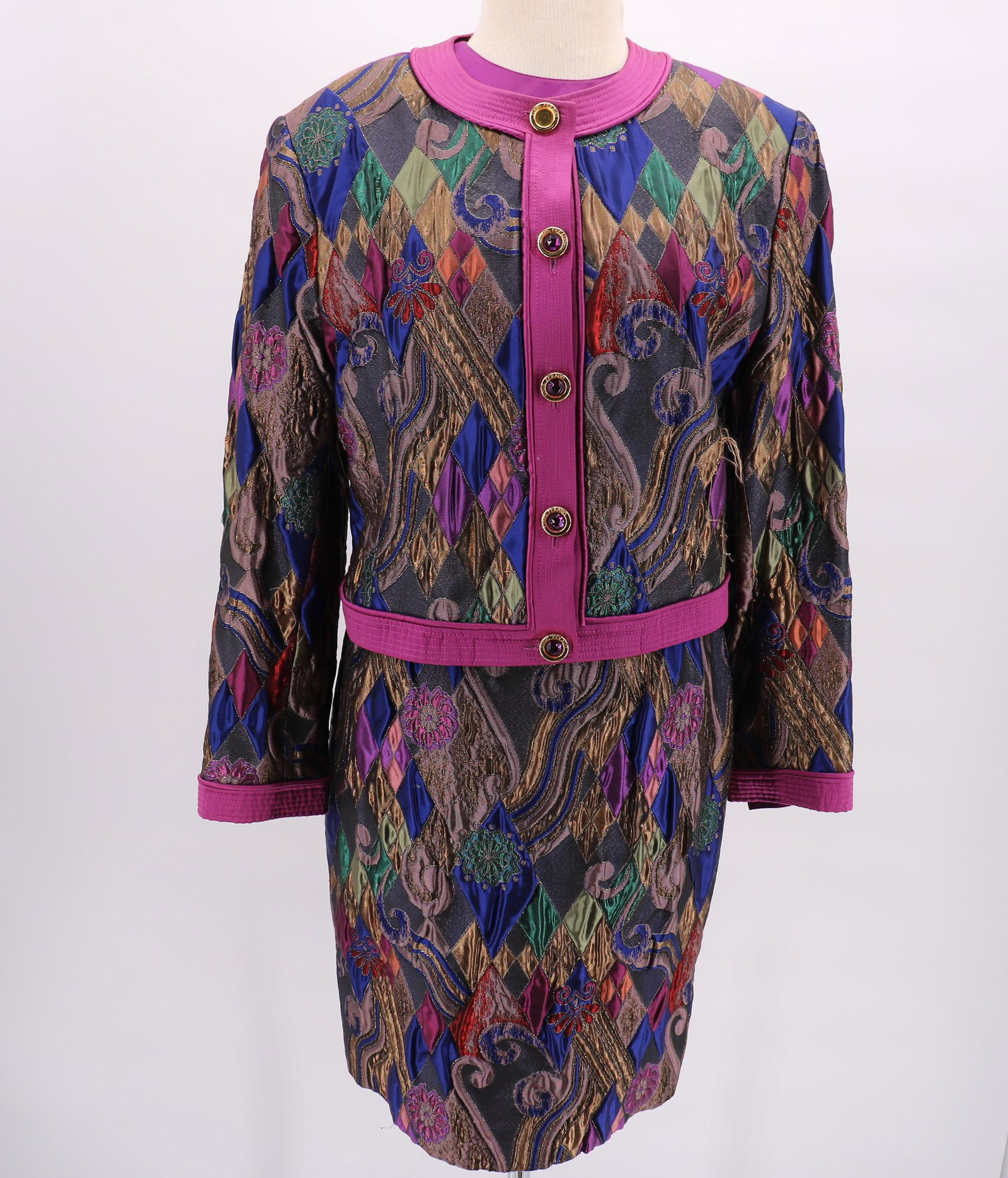 Vintage Louis Feraud Purple Suit: Purple satin long sleeve top, shoulder pads, one decorative button in back. Brocade skirt, lined, back zipper. Brocade and purple satin crop jacket with decorative front buttons (one button is missing