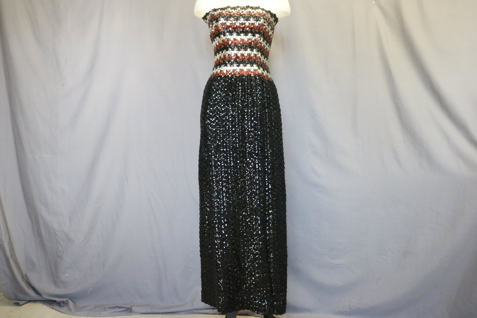 1960's Full Length Sequin & Knit Gown: fitted tube top type bodice with stripped sequin, sits high on waist, full length completely sequined skirt with back slit, zips up the back, approx. 36 bust, 32 waist, Has been taken in, can be let o