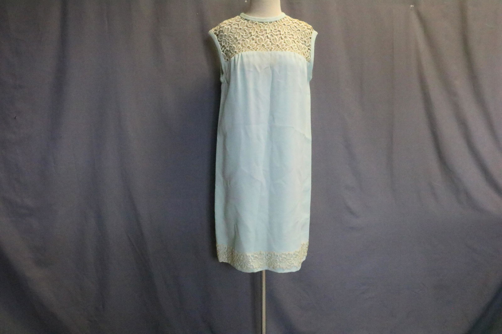 Vintage 1960 Pat Sandler Sleeveless Dress With Lace: With Schiffli embroidery lace at bodice and hem, zipper and snaps in back, approx. 38 bust, 37 long. There is soil, and light discoloration on front, see photos, lined, crepe fabric outer.