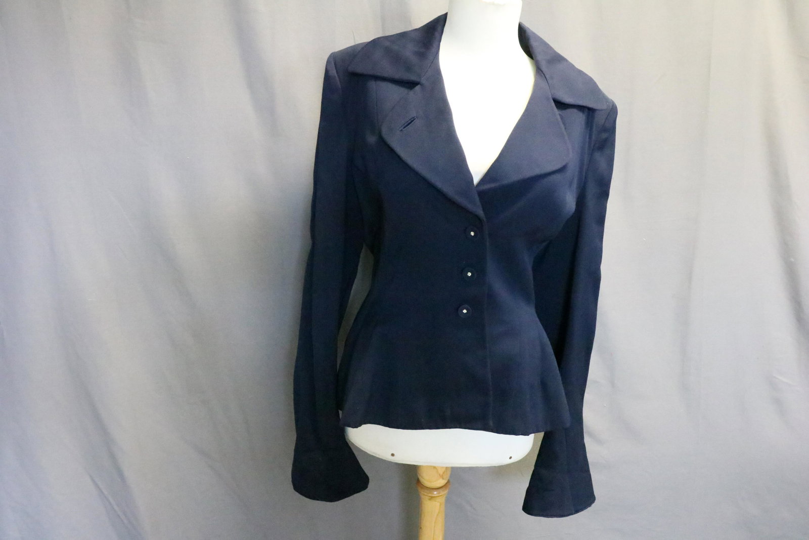 Vintage Navy Twill Blazer: Convertible collar with self covered buttons featuring tiny rhinestones, lined, approx. 36 bust, 32 waist, 23 long. Appears to be a wool blend twill fabric. Small 1/8" hole on left sleeve.