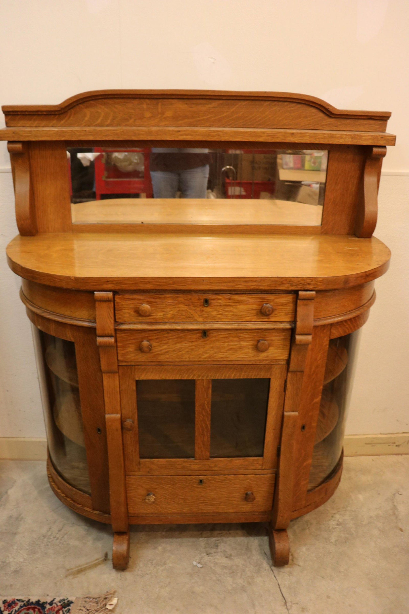 Antique Oak Buffet Curio Cabinet: antique oak buffet with mirrored back splash, curved glass doors either side, glass front double doors with 2 draws over and one under. Approx.