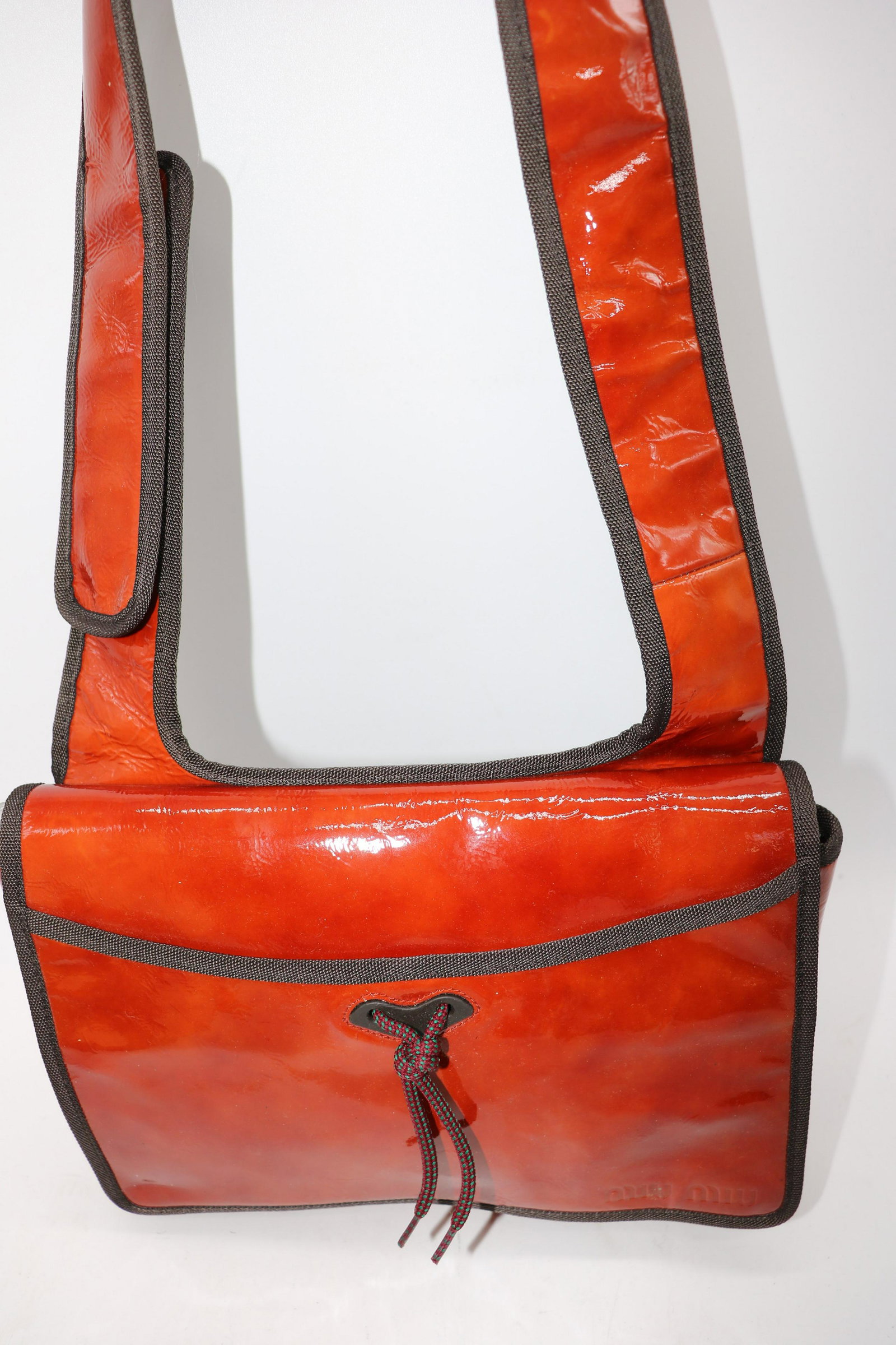 Miu Miu Burnt Orange Patent Leather Handbag: Made in Italy, two outside and one inside pocket, approx. 7x10". Great condition.