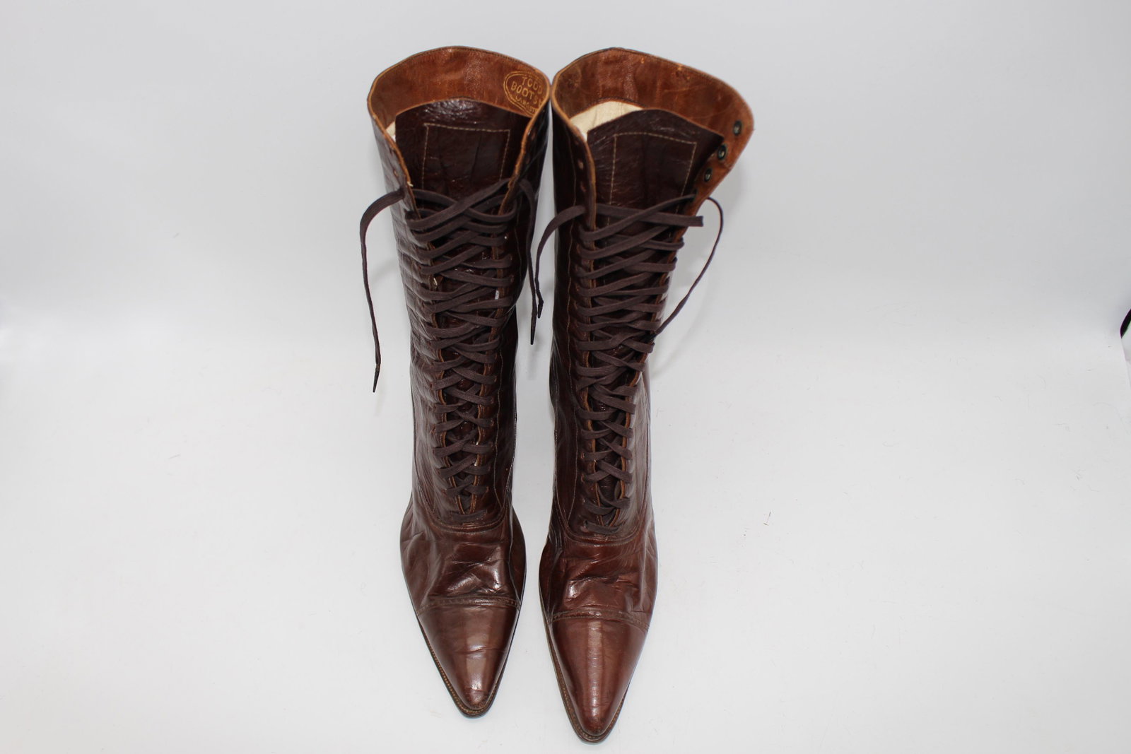 1900 's Brown Leather Lace-up Ladies Cap Toe Boots: Soft leather, 2 1/2" stacked heel, marked Todd's Boot Shop, Lancaster. Bottom approx. 11" long, 2 1/2" wide.
