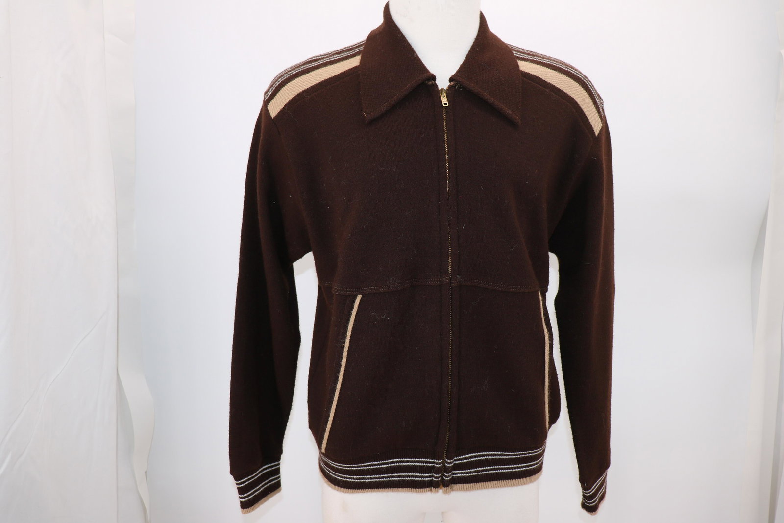1970's Brown Zipper Cardigan: Contrast detail at shoulders, front pockets. Approx. 44 chest, 26 long, 18 across shoulders. Labeled acrylic.