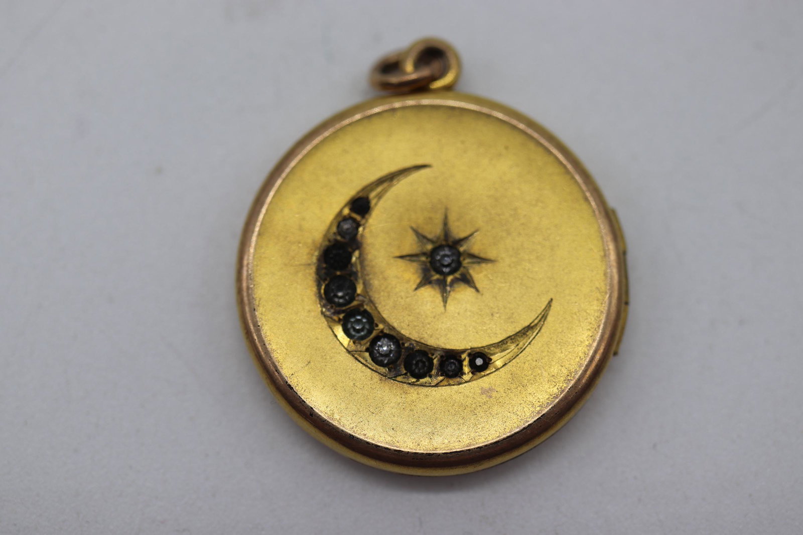 Vintage Locket with Moon & Stars: gold tone locket with stone inlay moon and stars