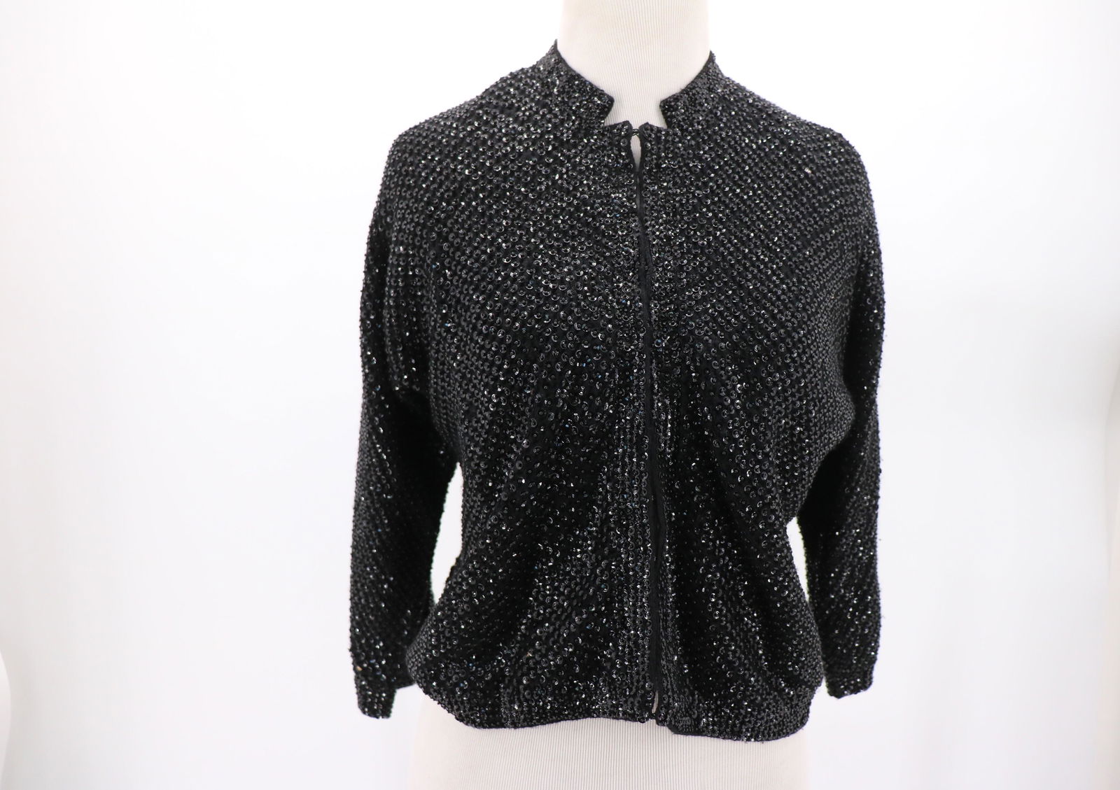 Cyn Les Vintage 1950's Beaded & Sequin Cardigan Sweater: black wool sweater with beading and sequin through out, 3/4 Dolman sleeves low collar, eye hooks down front, fully lined in great condition, approx. 40 bust. Snaps around neckline, possibly for collar