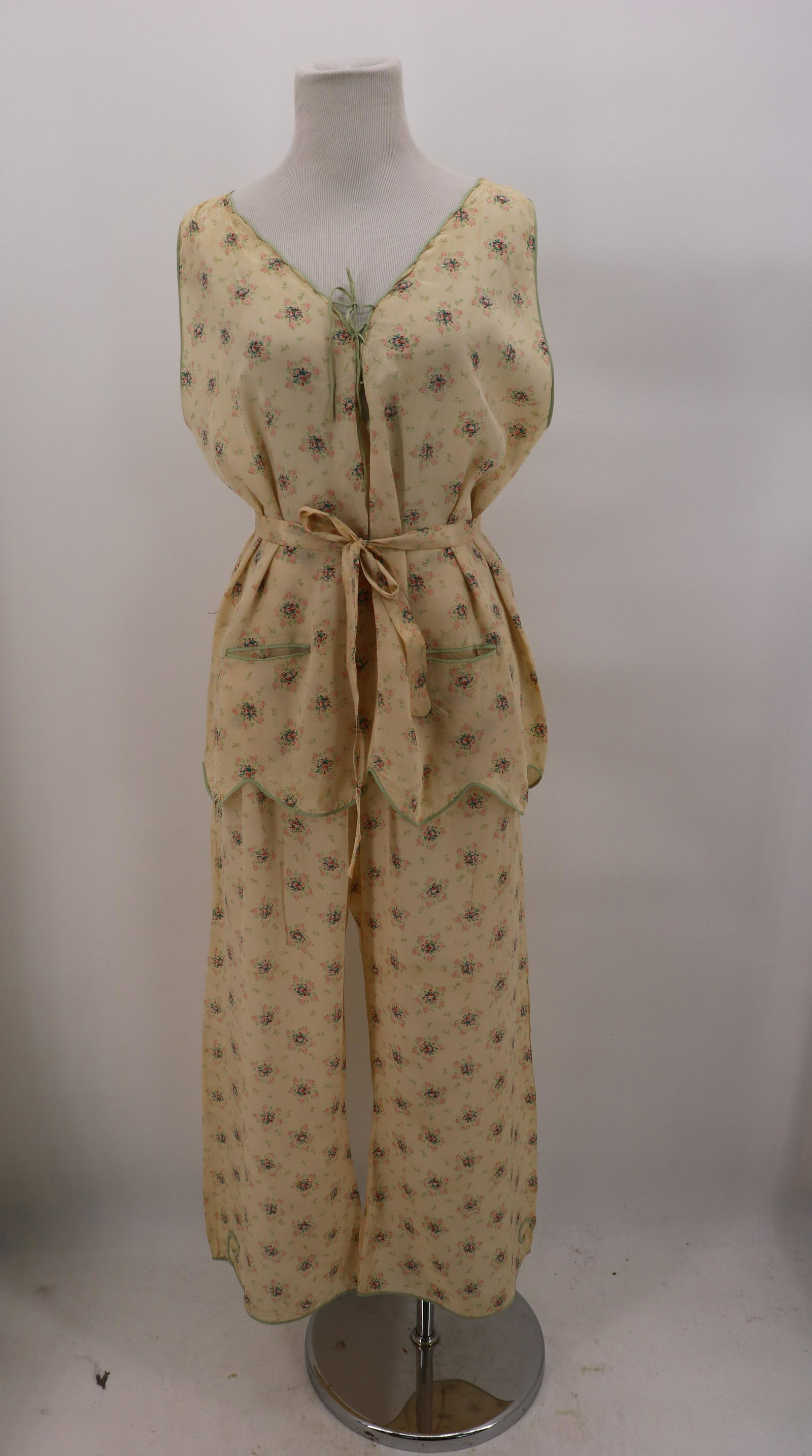 1920's Marshall Fields & Co. Silk Floral Pajama Set: sleeveless V-neck with corset style tie front, lower front pockets, scalloped hem all trimmed in minty green silk piping, has fabric tie belt, pants are with wide waist band and buttons, and wide legs
