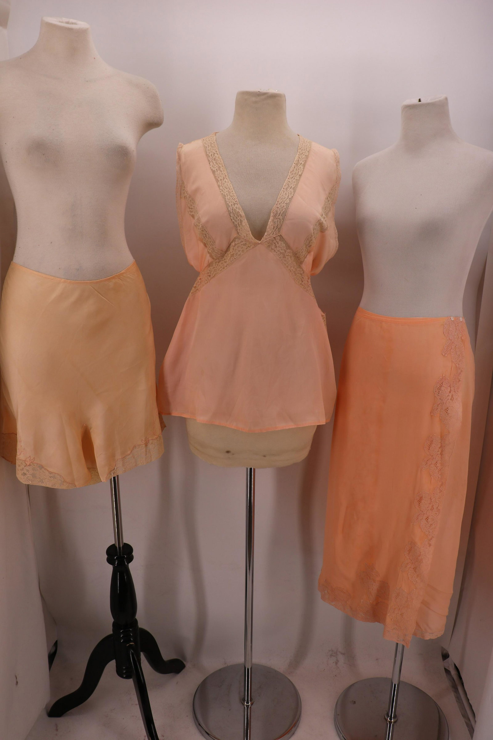 Lot of 1920-30's Silk Lingerie Top, Tap Pants, Slip: All 3 have lace. Peach wrap style lingerie top with lace, 44 bust and waist, 3 very small holes in front. Wrap style slip with button at side, , some very small holes. "I. Magnin Co." bias cut tap pan