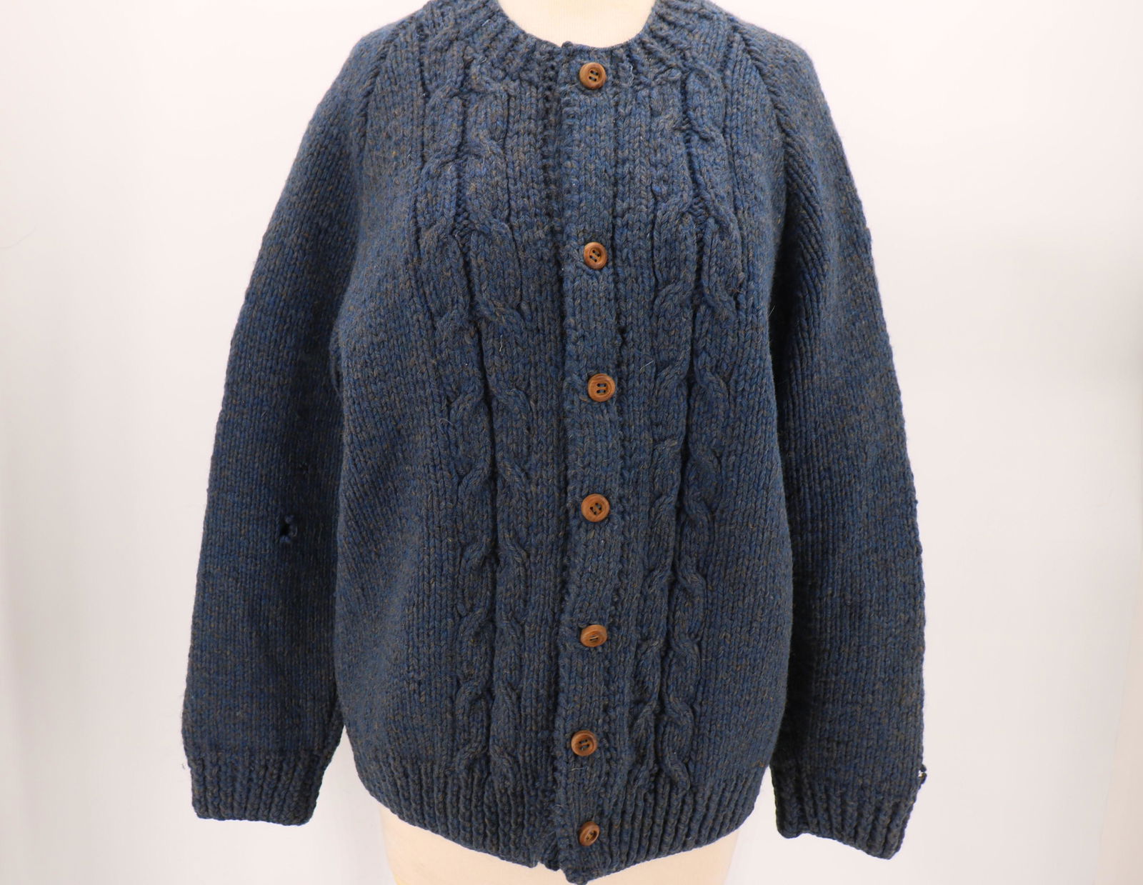 Vintage Hand Made Cable Knit Cardigan Sweater: Wooden buttons down the front, approx. 44 chest, 26 long. 1" hole in each sleeve, 1/2" hole on front.