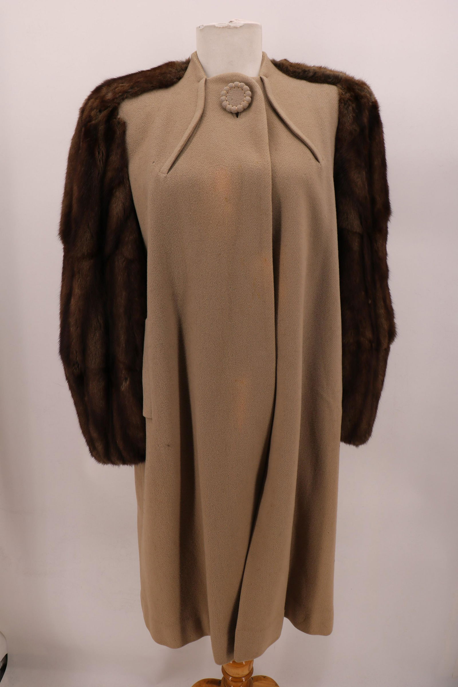 1940 "Avedon" Wool & Mink Coat: One large covered button and snap in front, mink sleeves, fully lined, front pockets, approx. 42 bust, 41 long. Light soil on lining, and coat. Some very small holes in the wool. Some wear on the fur,