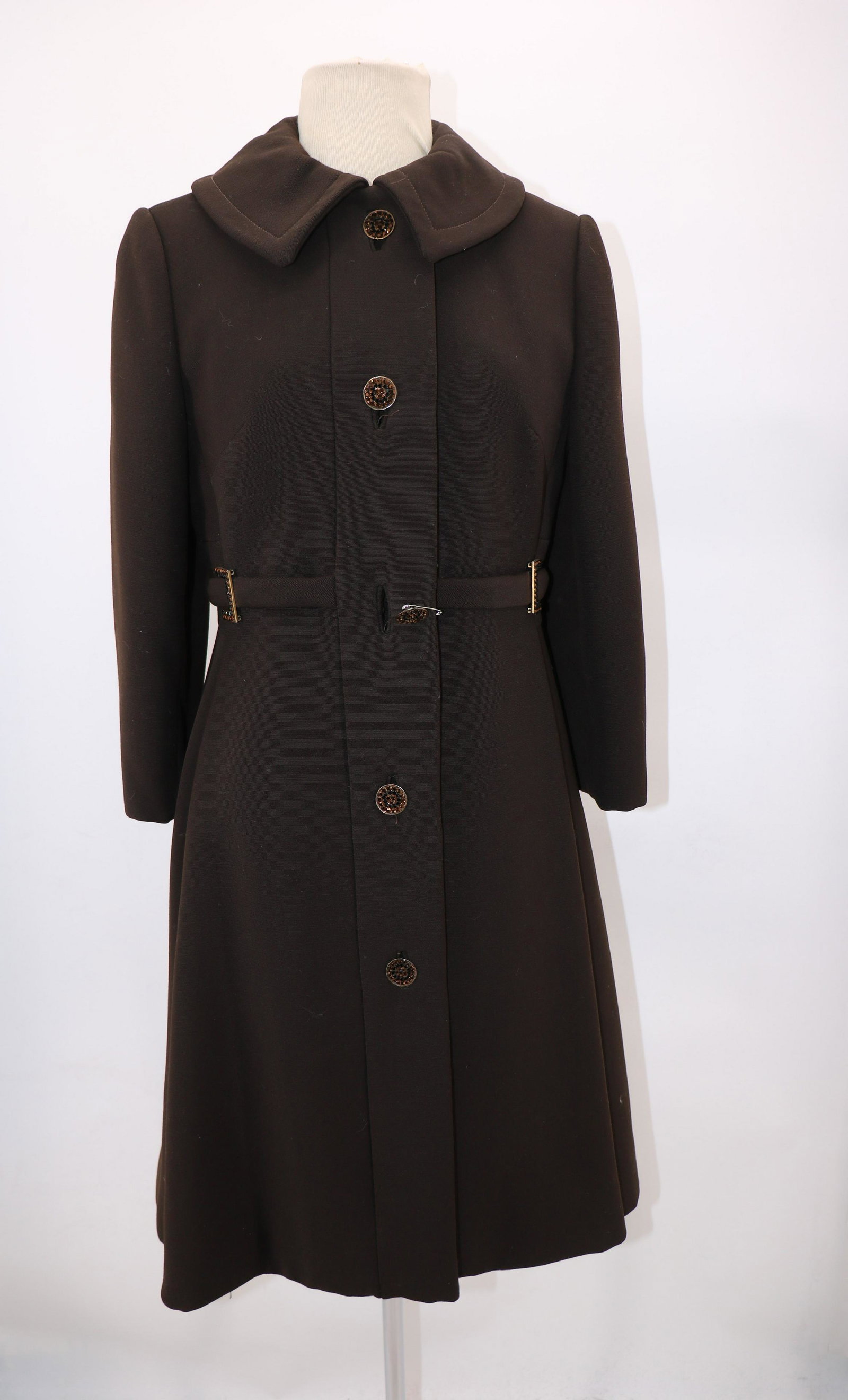 1960's Anne Starr Brown Wool Coat: Fully lined and insulated, Decorative buttons and belt buckles in front (one button needs to be sewn onto coat), 36 bust, 16" across shoulders. No sign of wear.