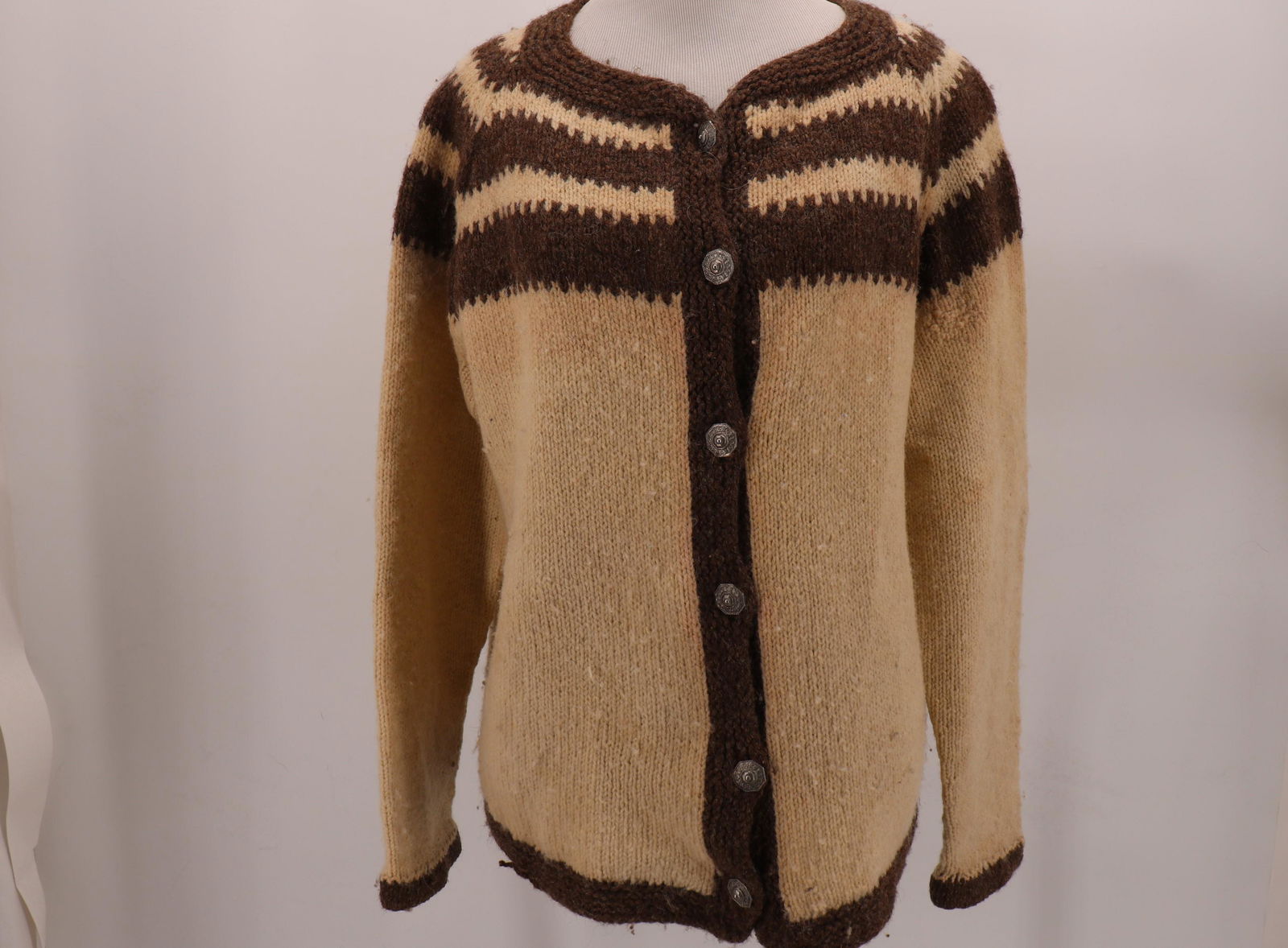 Vintage Hand Knit Cardigan Sweater: Metal buttons, raglan sleeves, 40 bust, 25 long. Many holes on, repair on left sleeve, see photos.