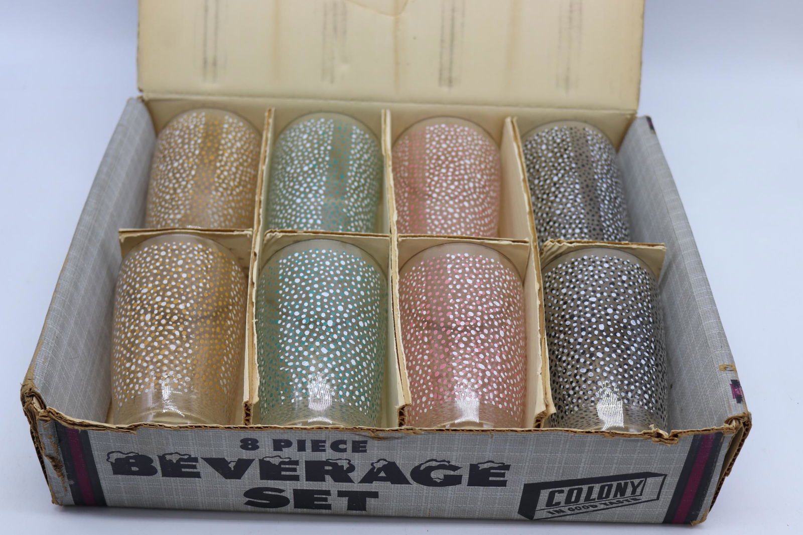 Vintage 8 Piece Old Stock Colony Beverage Set, 1950's: new in box, old store stock, multi color fire-king one handle bowls, one plastic lid is cracked