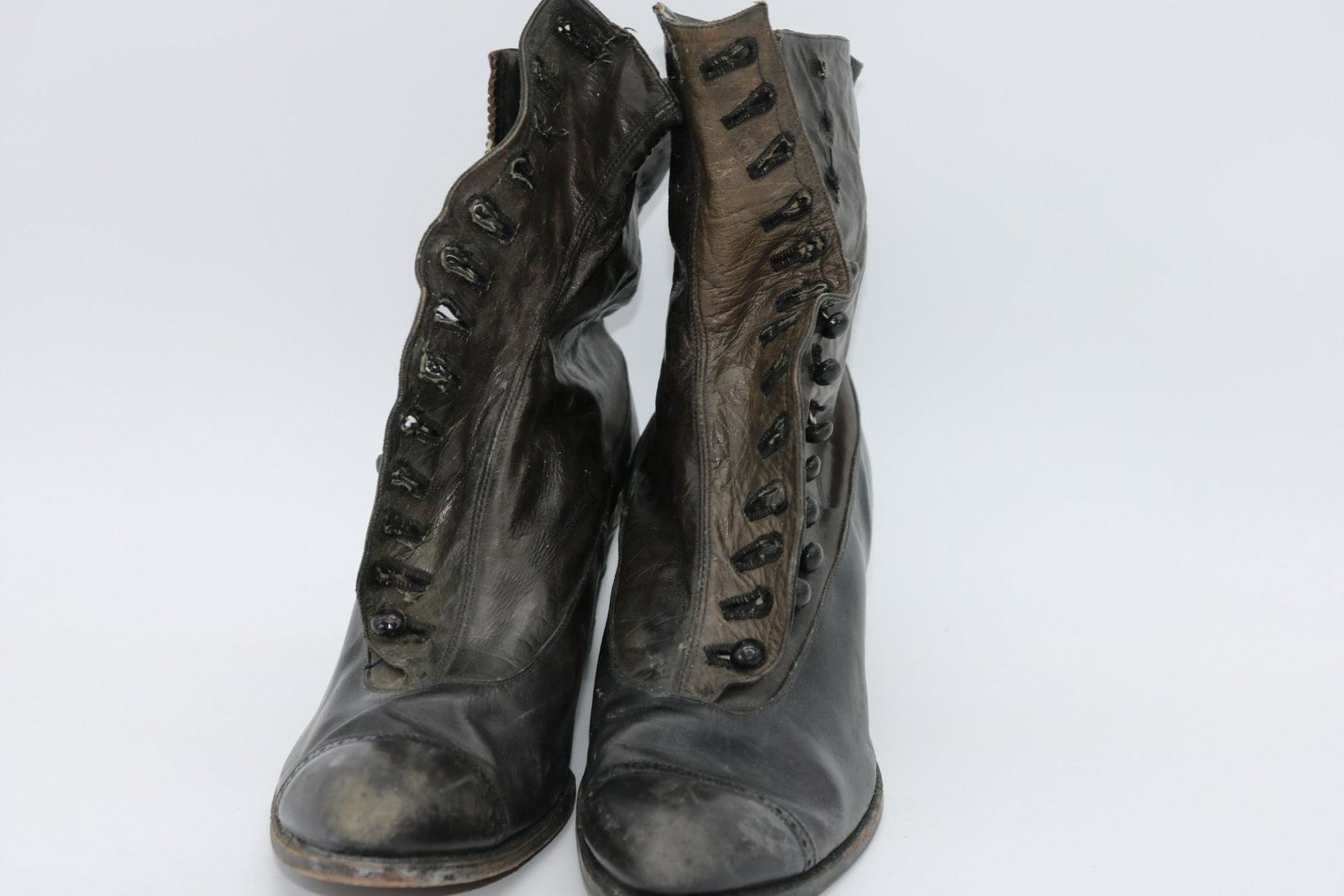 Antique Victorian Leather Women's Button-Up Boots: Stacked heel (2"), button up (some buttons missing, see photos), canvas lined. Shoe bottom shoes wear, as well as heels, scuffs on leather, measures approx. 11" long, 2 3/4" wide.