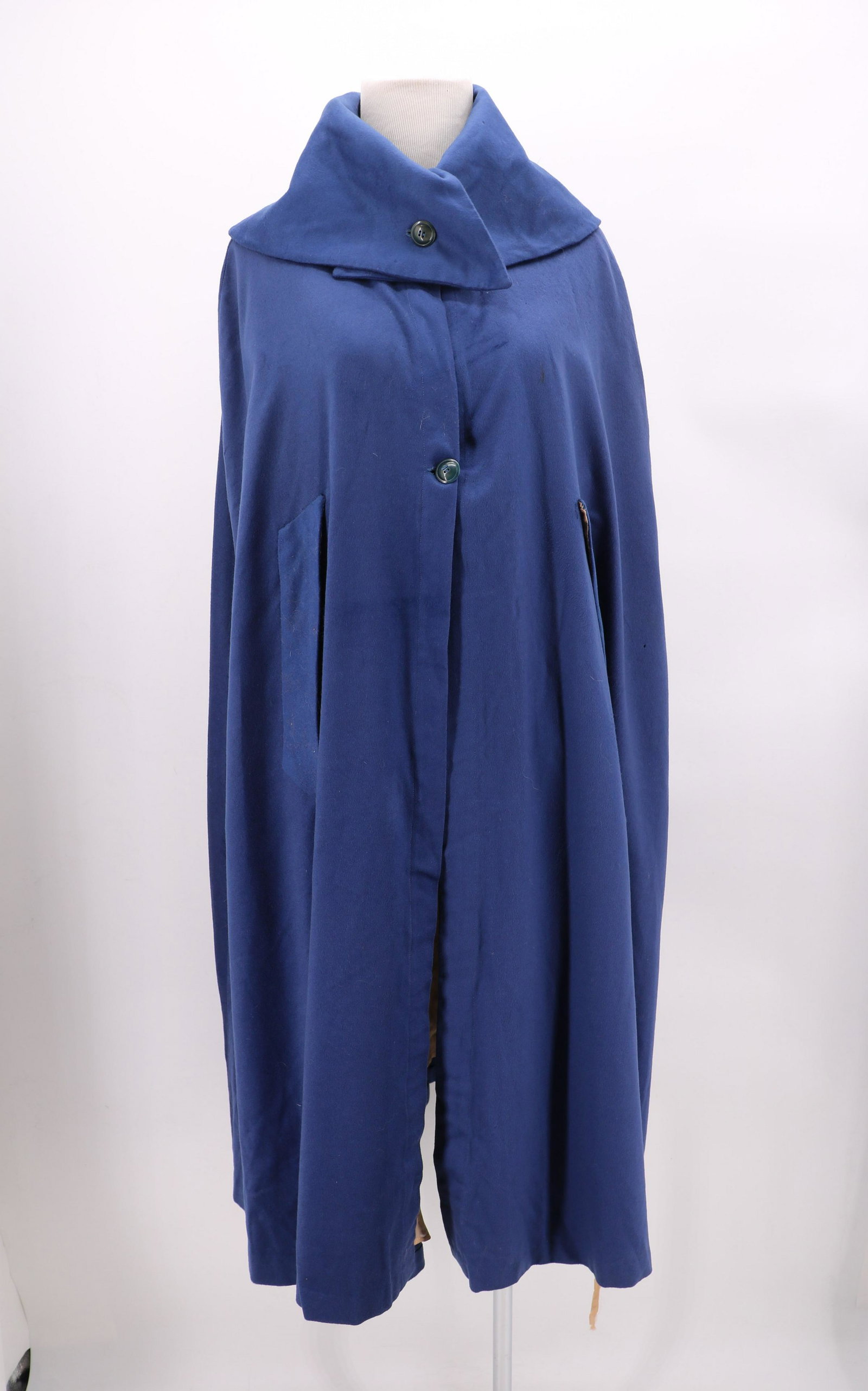 Antique Blue Wool Cape, Silk Lined: Large exaggerated collar, 2 buttons on front, one button on collar, approx. 40 bust. Some small holes in the lining and in the wool. Some discoloration on back.