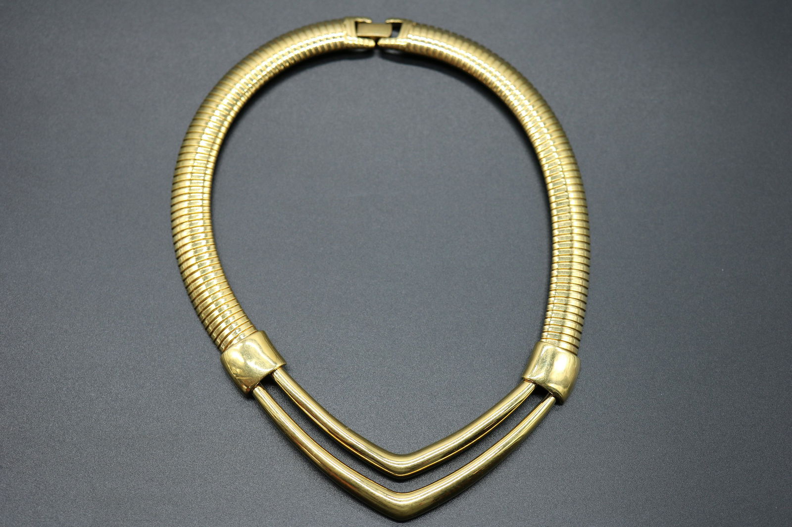 Vintage Monet Bib Style Necklace: gold tone serpentine with double V front.