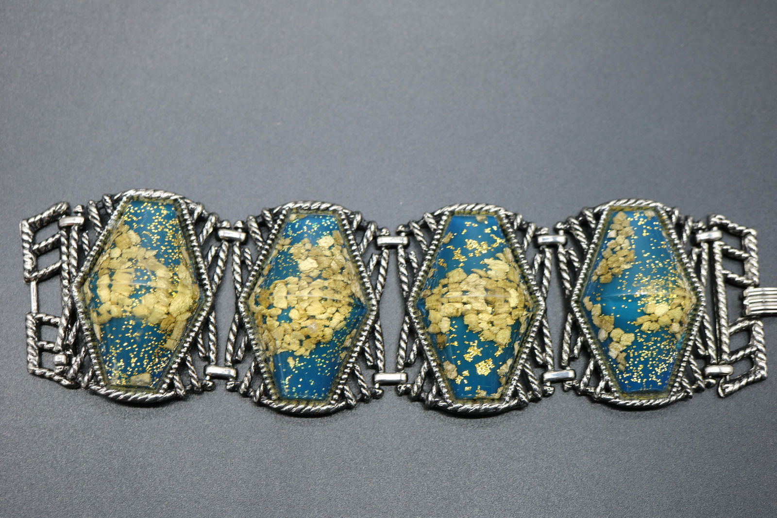 Vintage Silver Tone & Lucitte Bracelet: 4 large silver tone links with large lucite beads filled with stones and gold fleks and blue base, approx. 2 1/8th inches wide