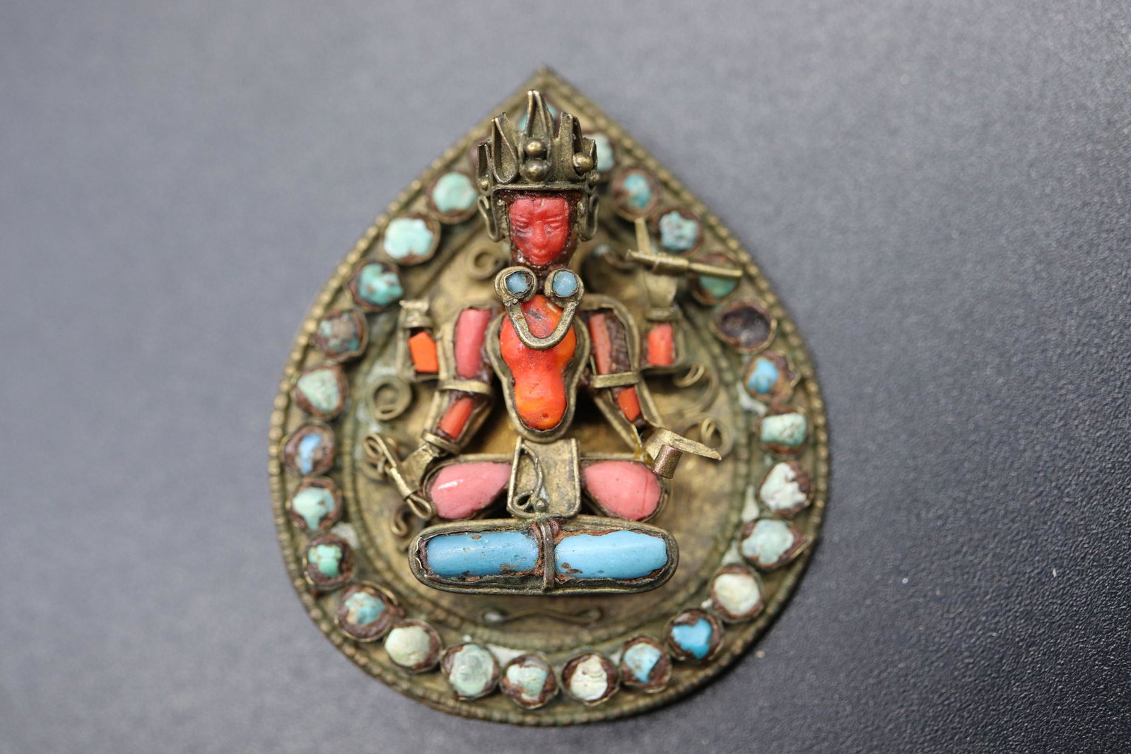 Antique Chinese Tibetan Coral & Turquoise Buddhist: brass tone setting 3/d Buddhist figure with coral and turquoise stones, approx. 1 3/4 inches tall