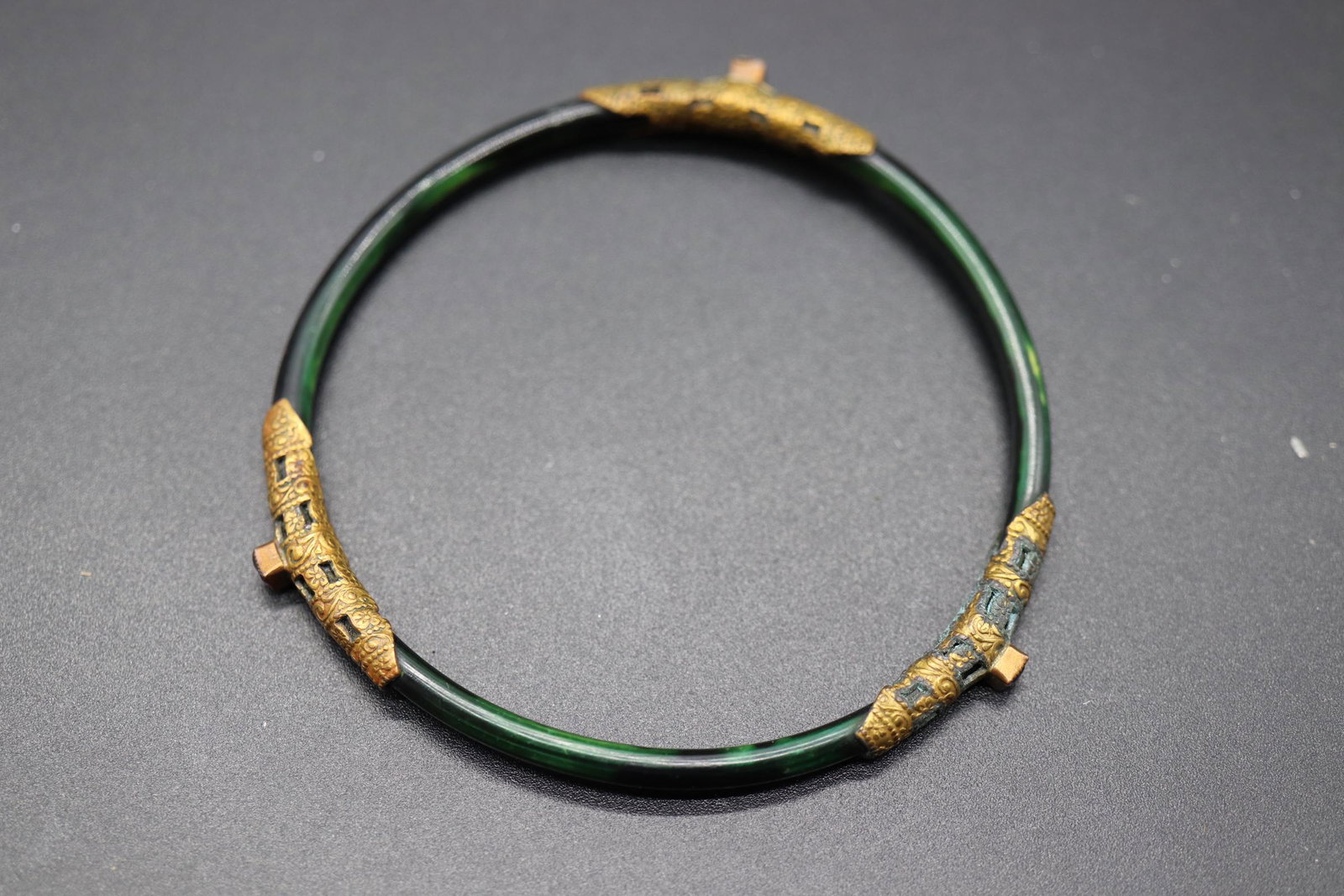 Antique Victorian Bangle Bracelet with Purple Stones: green & black bangle with gold tone etched pieces and small emerald cut purple stone, approx. 3 inches across