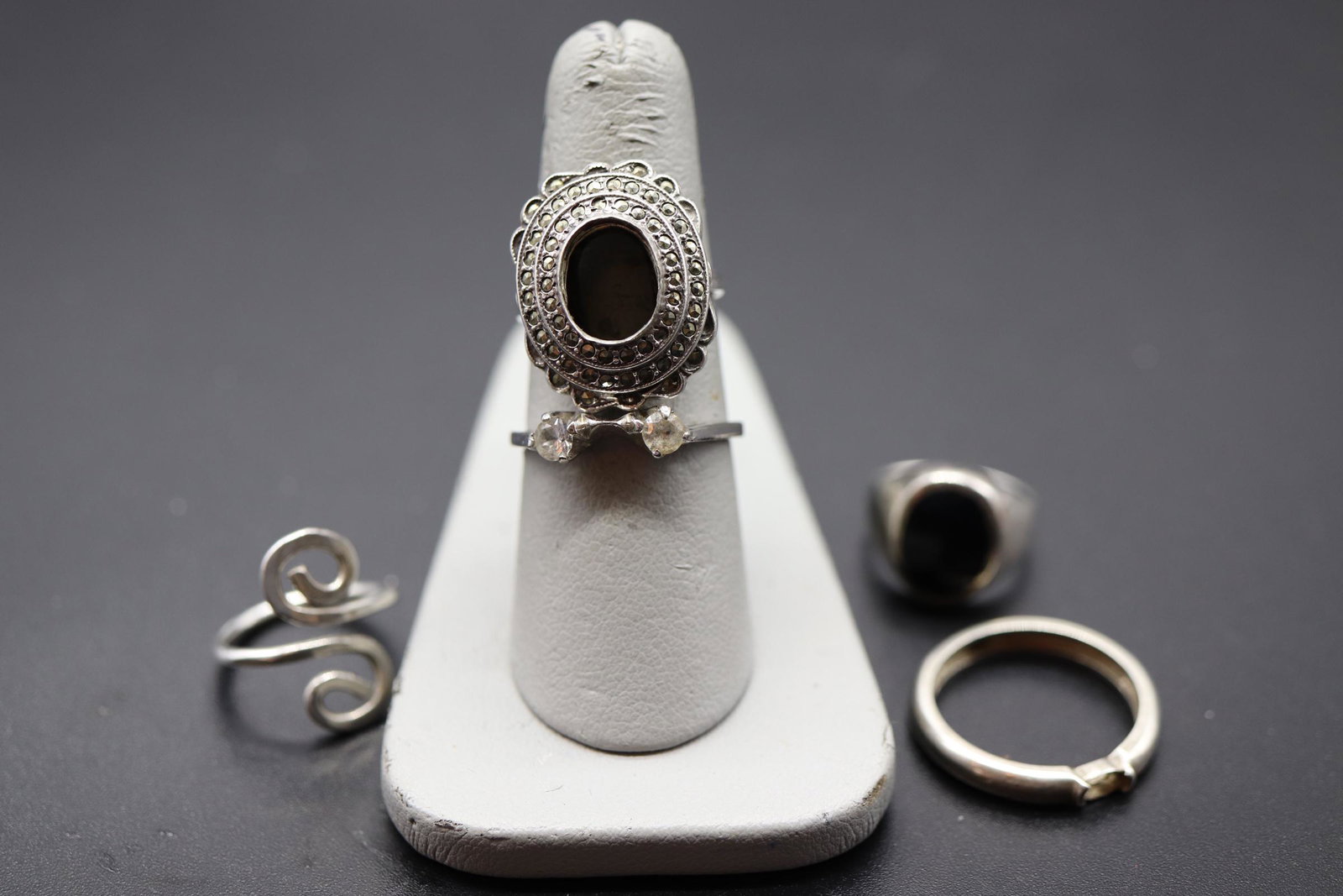 Lot of 5 Vintage Sterling Silver Rings: Marcasite missing stone size 6, silver swirl size 3, tiny clear double stone size 8, black stone size 3 1/2, plane band missing stone size 8 3/4