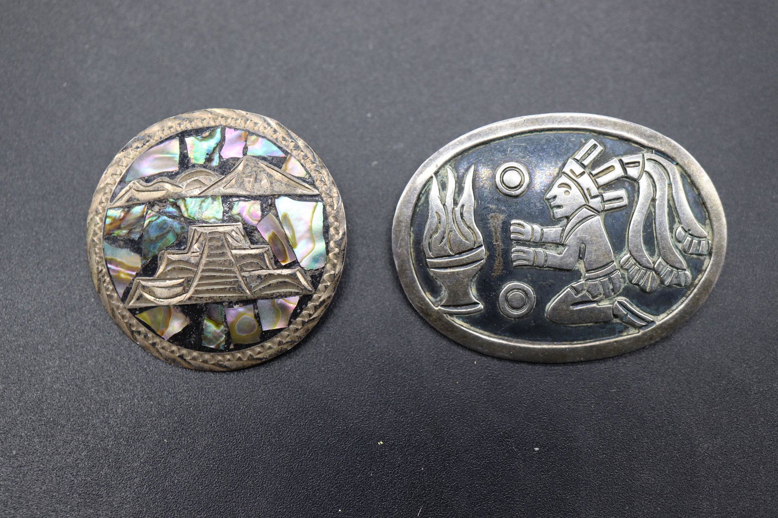 Lot of 2 Sterling Mexican Aztec Brooches: artist markings, sterling carved and abalone inlay