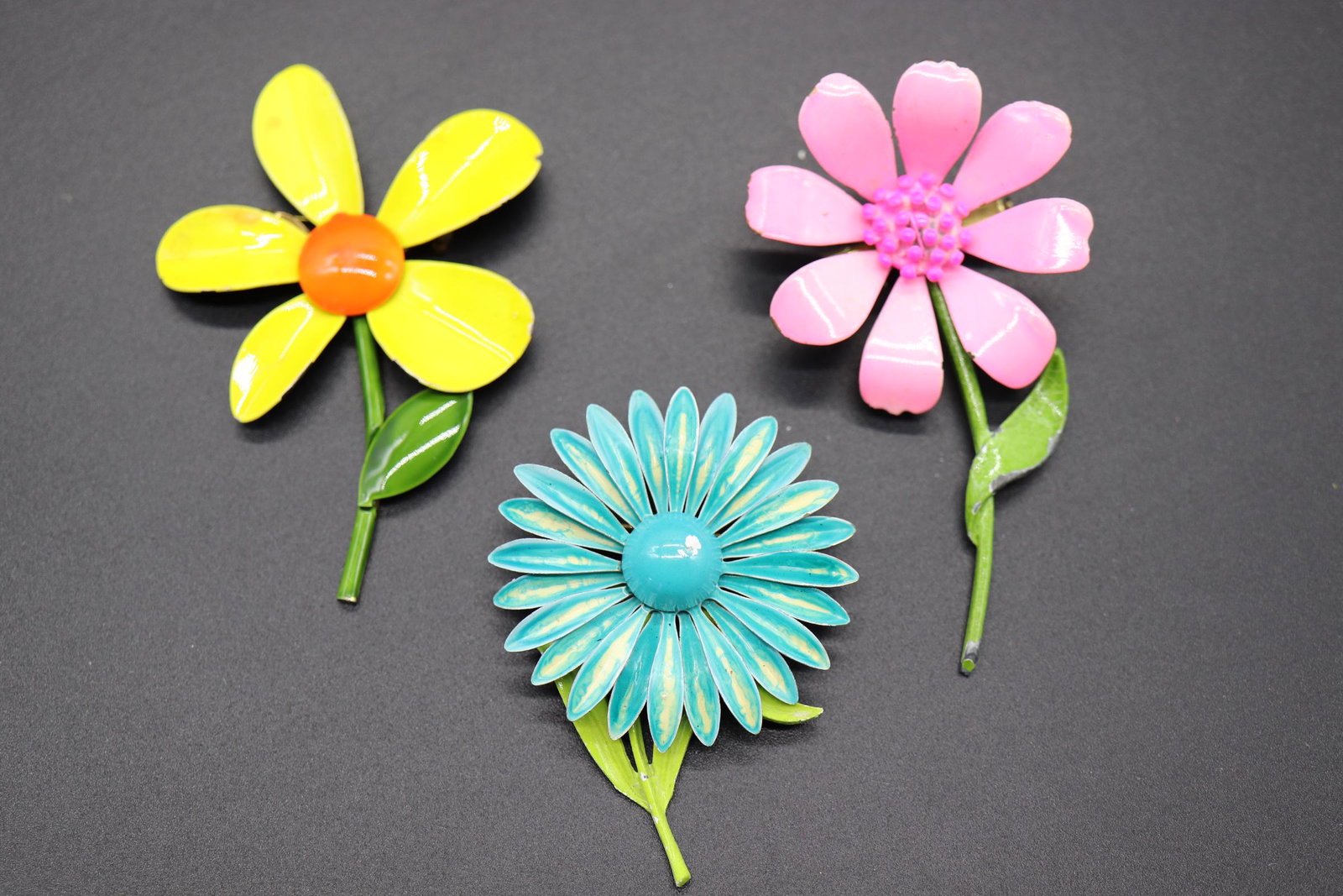 lot of 3 Vintage Enamel Flower Brooches: daisy and sunflower brooches, some minor chips, approx. 2 1/2 to 3 1/4 inches tall