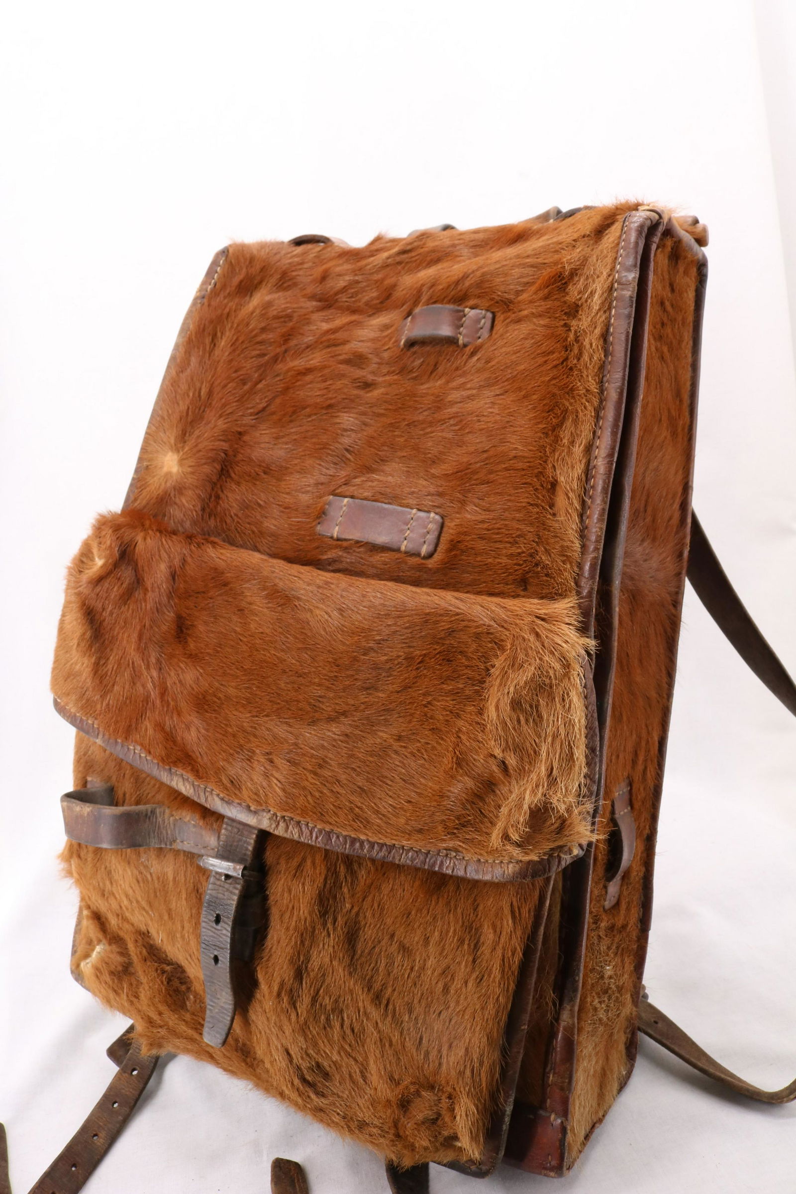 Antique WWII Swiss Army Ruck Sack, Zoller: pony fur, swiss military red cross mark on leather strap, had canvas bags inside with brushes, seams to be all intact and good condition, approx. 18 x 11 x 5